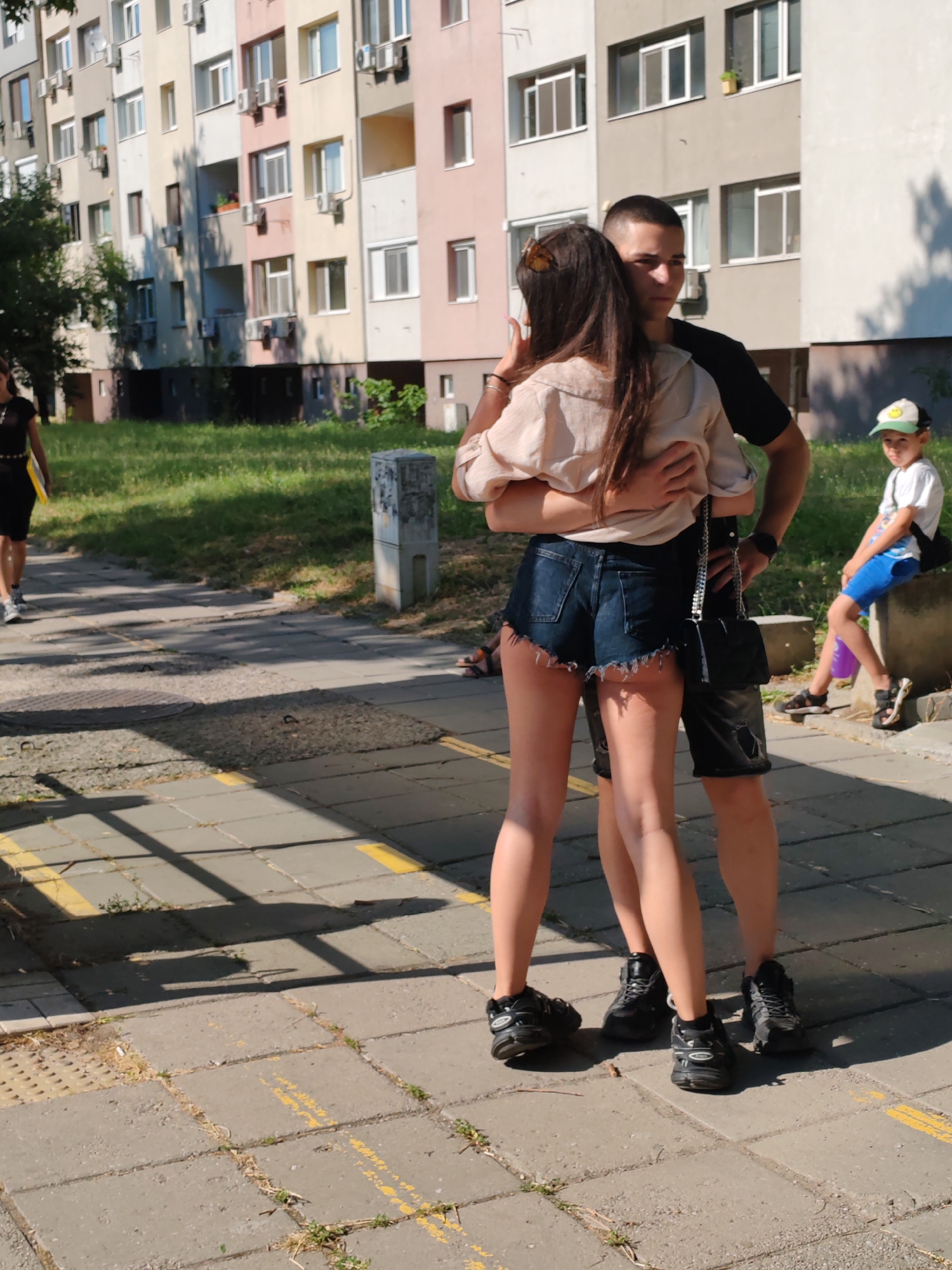 A quiet embrace outside apartment buildings in Burgas