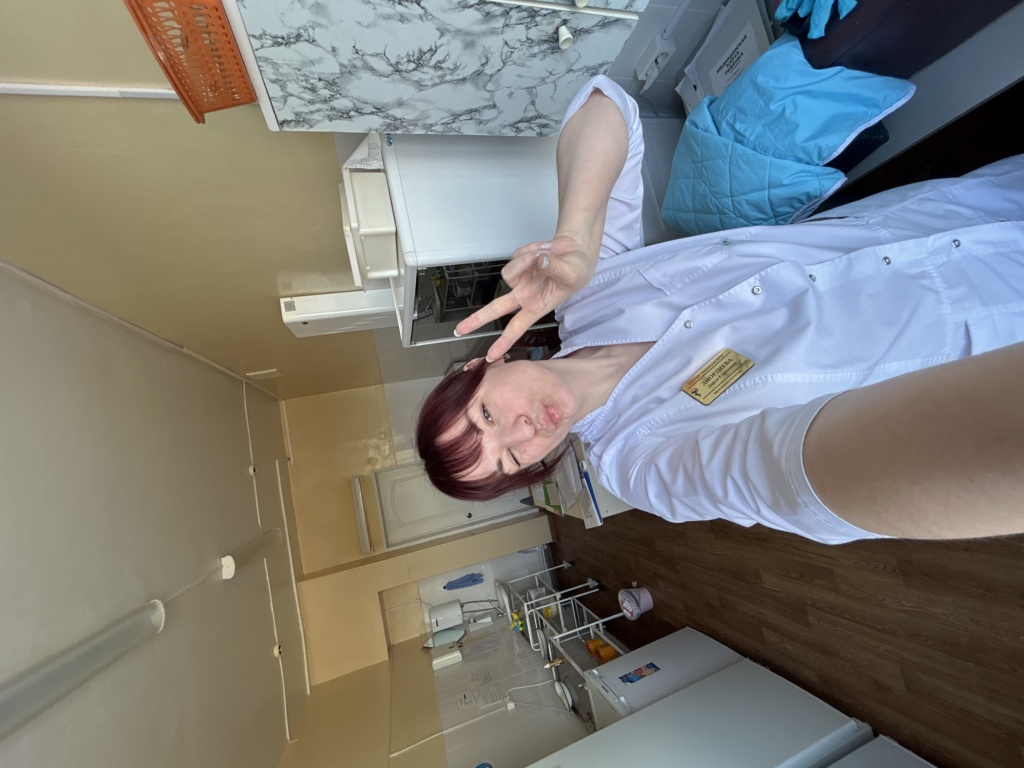 Healthcare worker takes selfie at medical clinic in Russia
