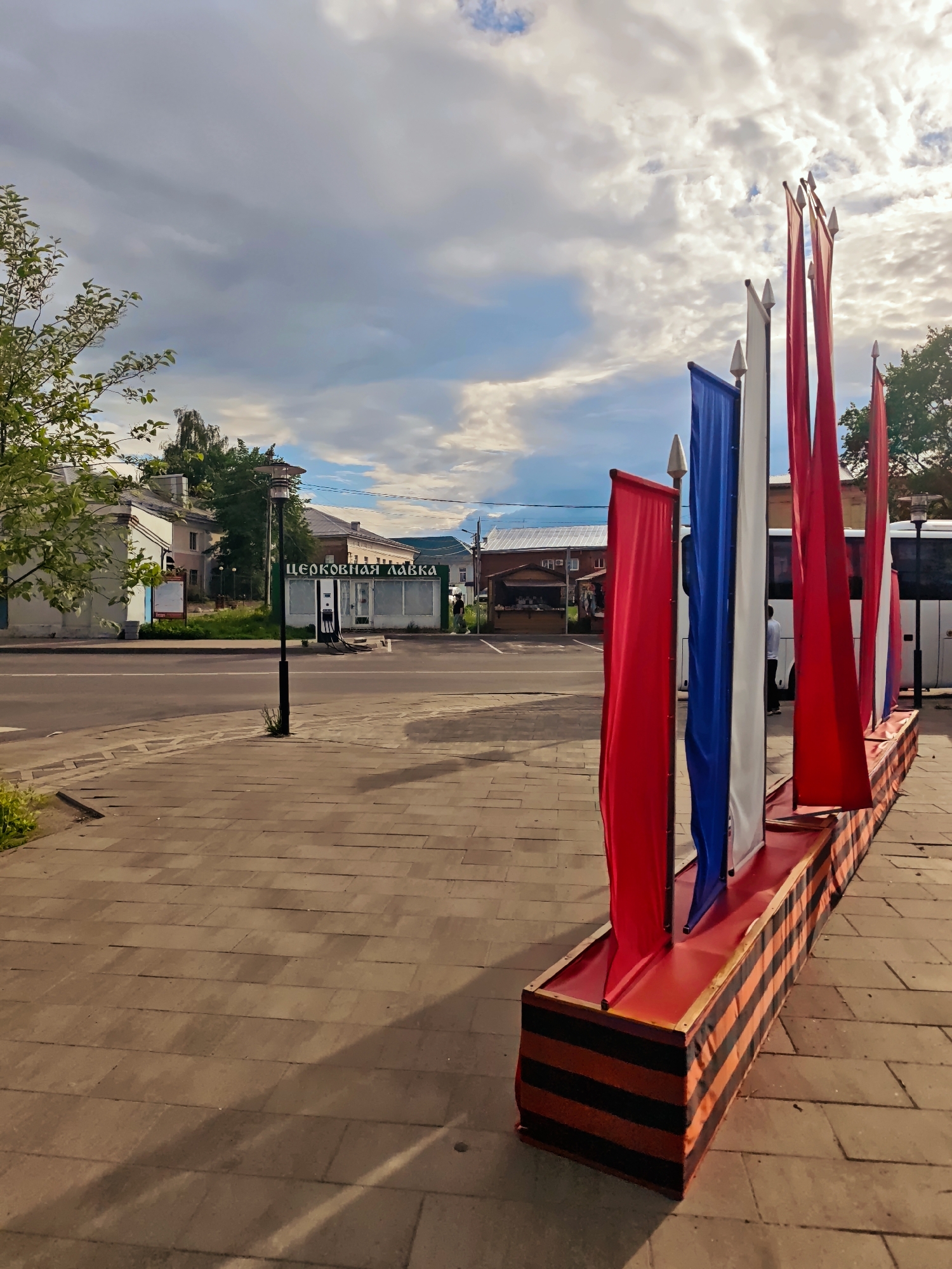 Urban scenes captured: flags, marketplace activity, civic architecture