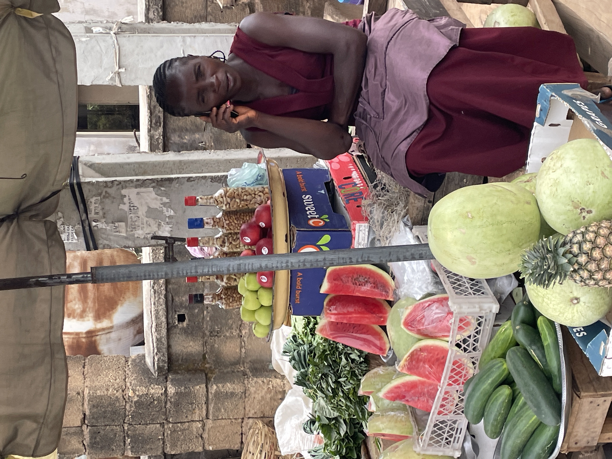 Woman vendor operates produce stall at Jos market