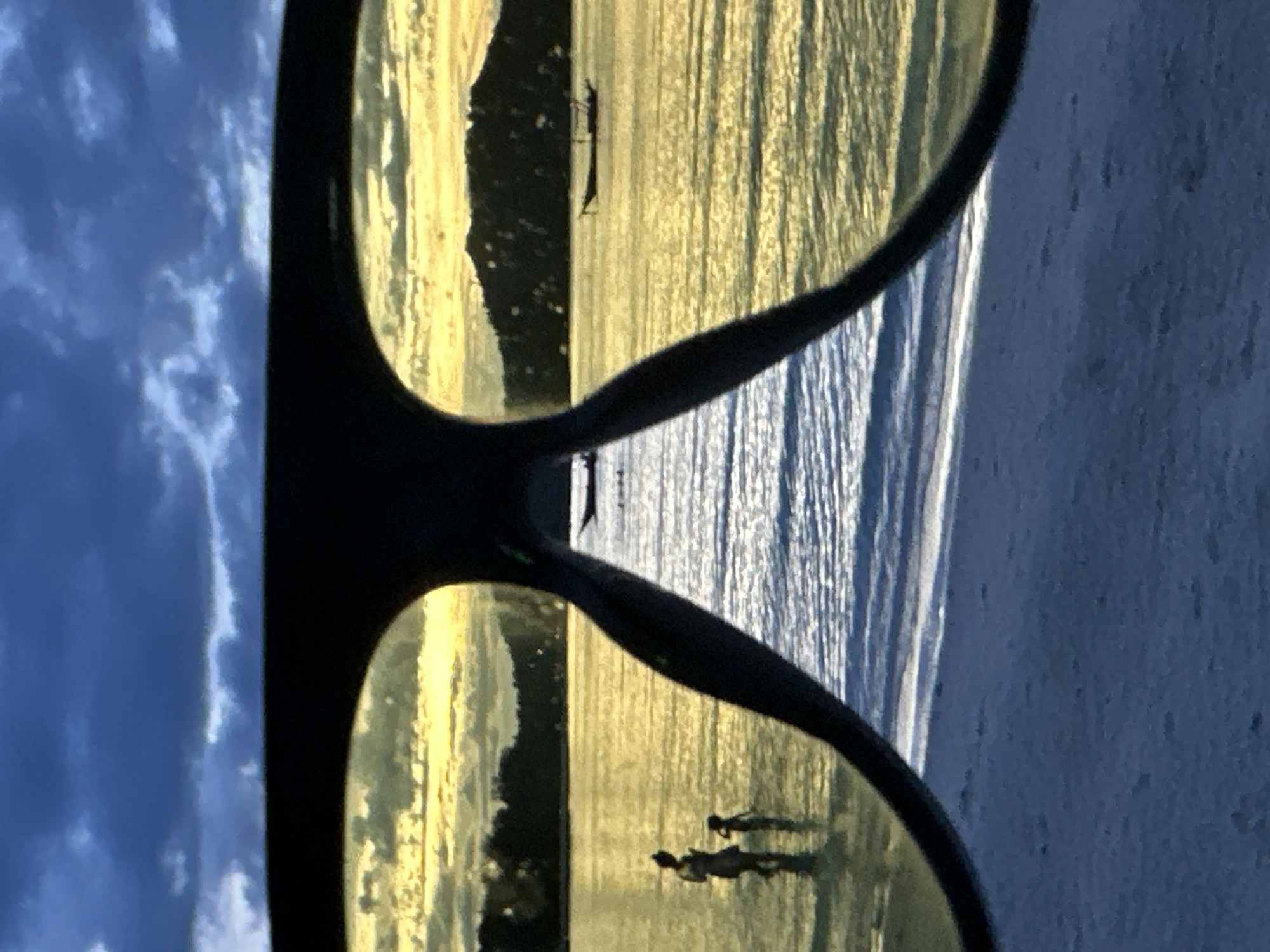 Sunset beach reflected in sunglasses on Koh Phangan