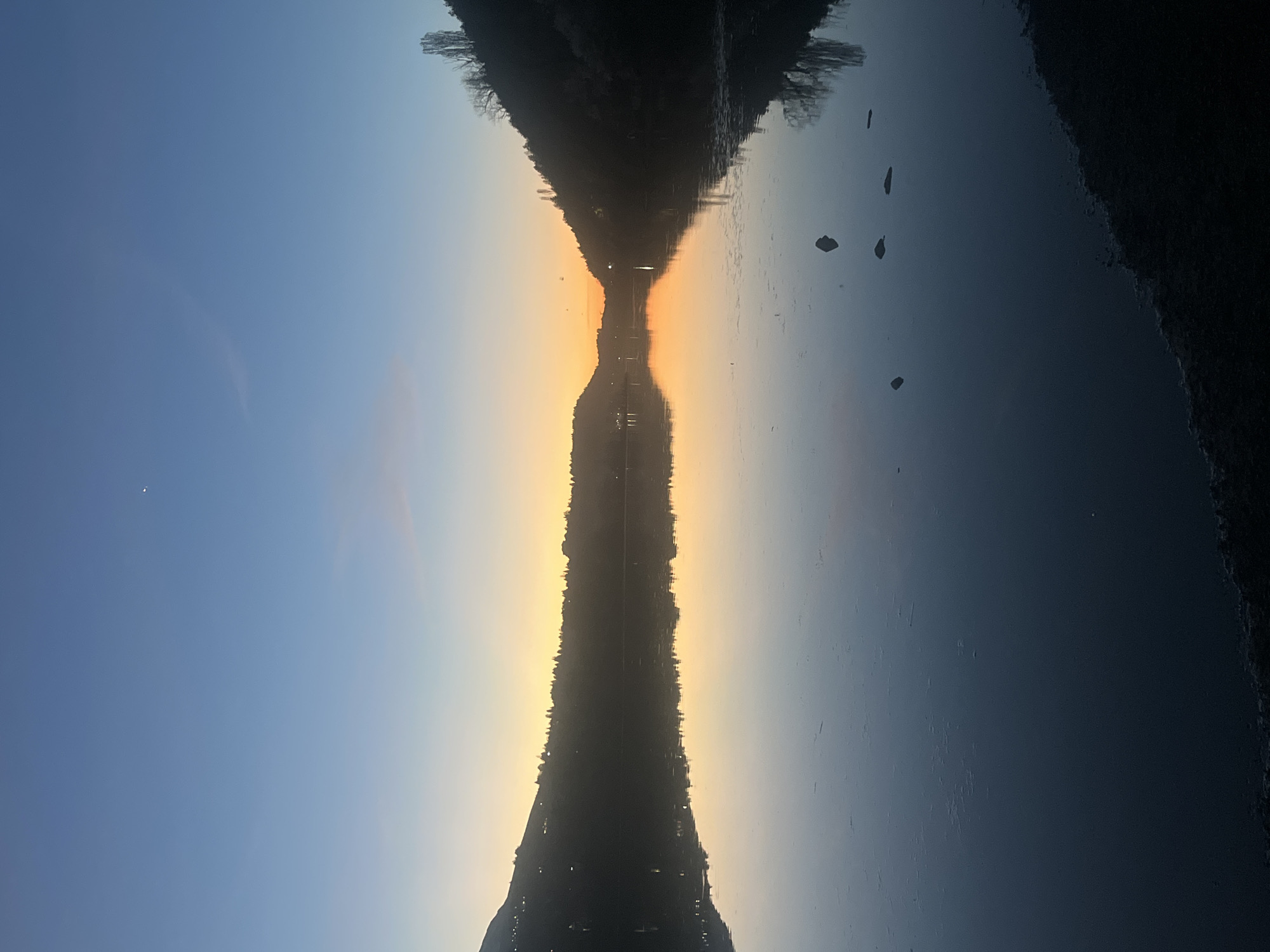 Sunset reflected on lake waters in Pancharevo, Bulgaria