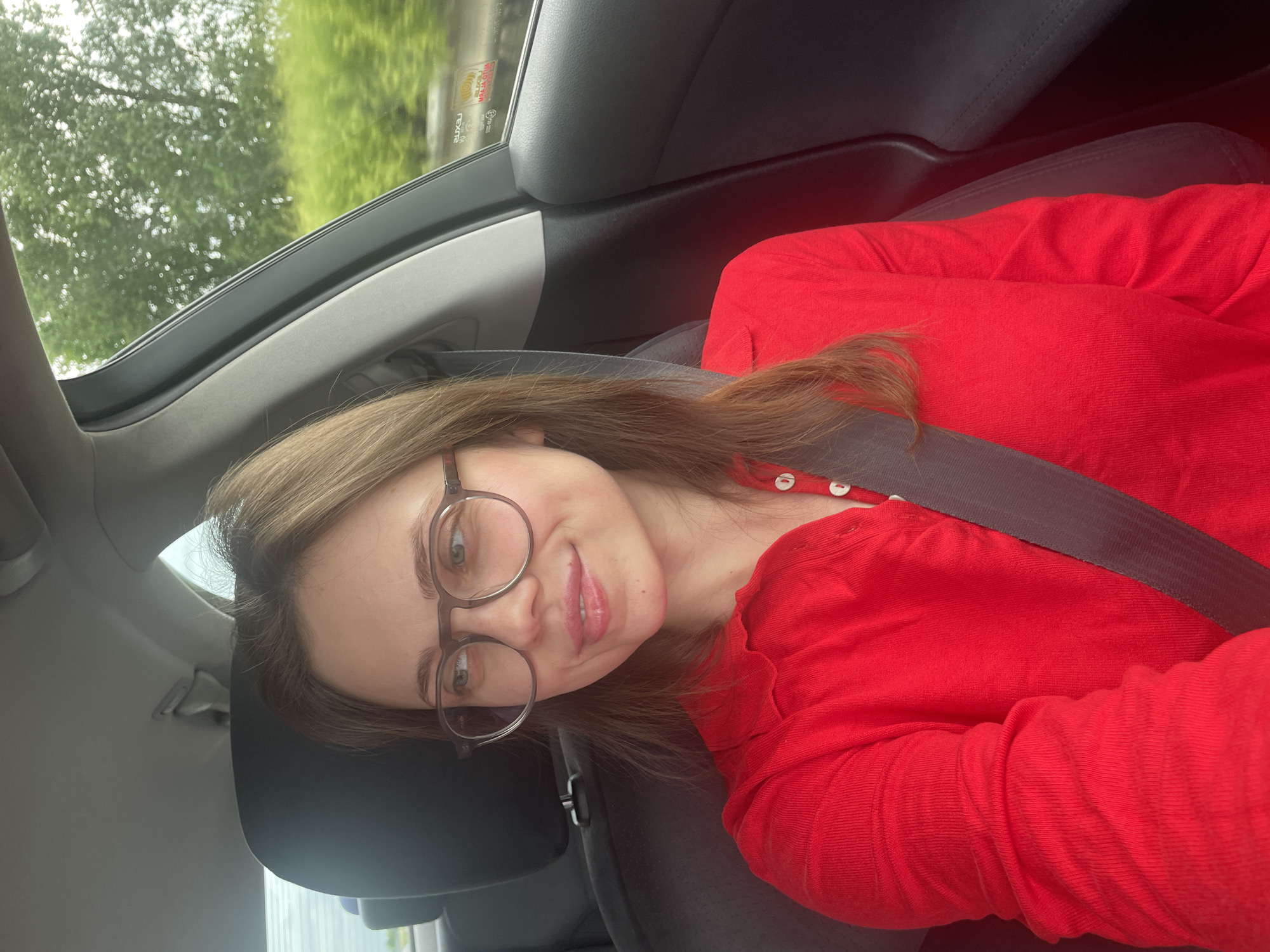 Woman in red shirt travels through Hungarian countryside
