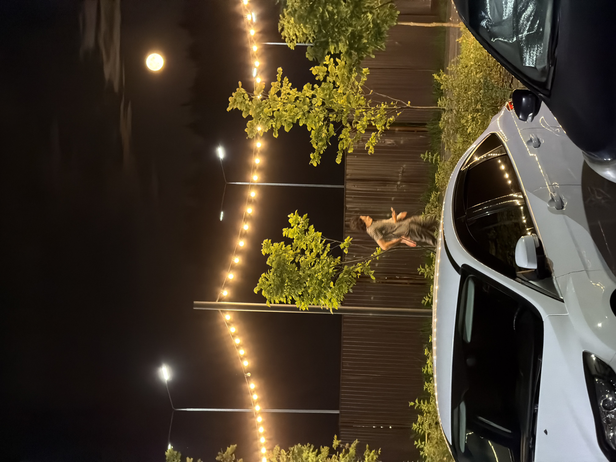 Full moon night at a Russian apartment complex parking lot