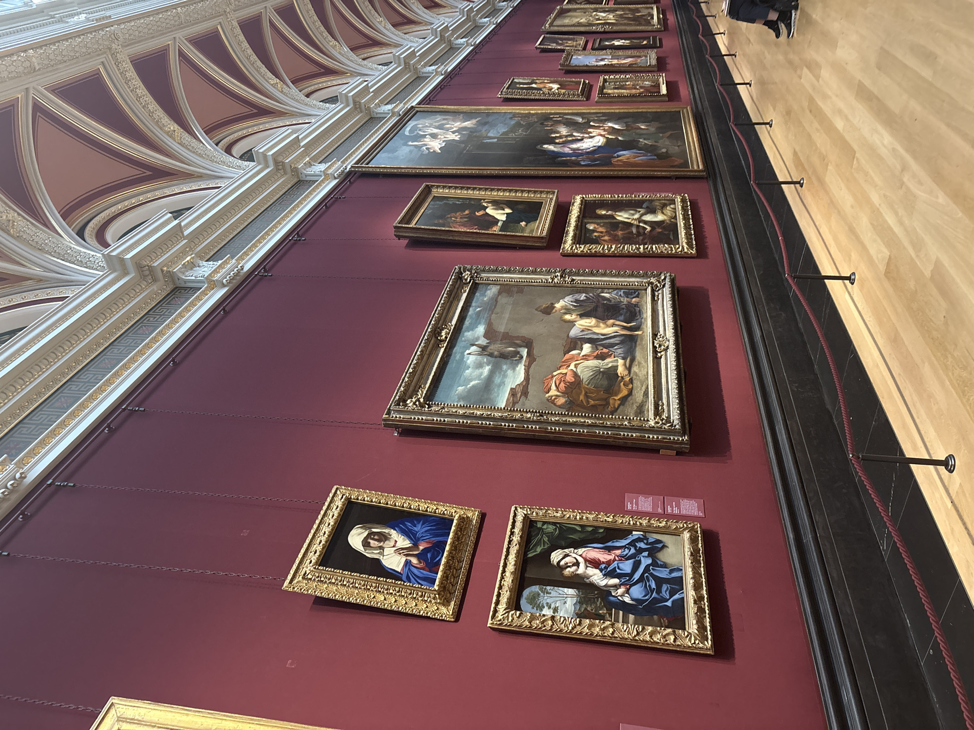 Religious artwork observed on red wall at National Gallery