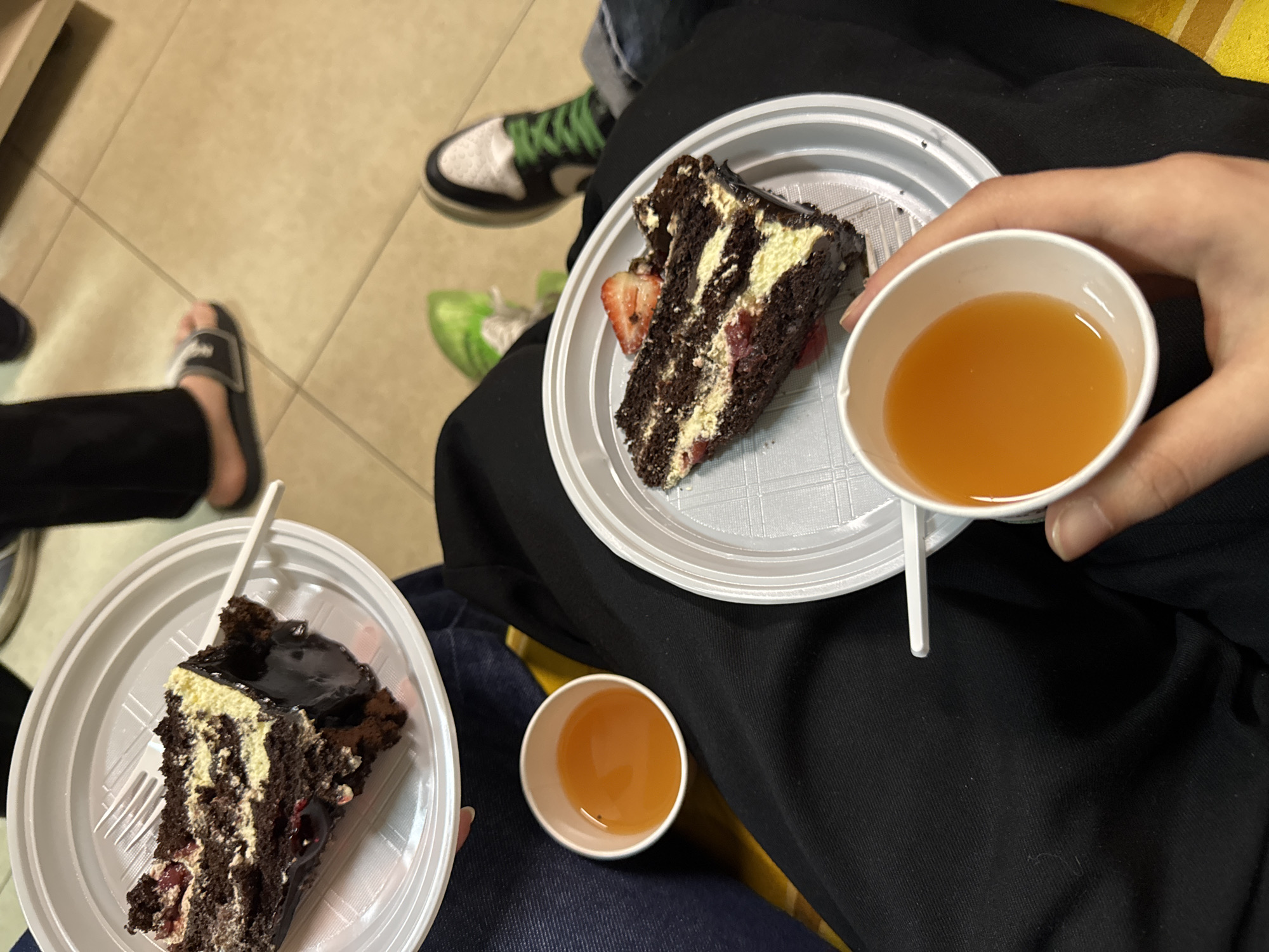 Two people share dessert moment indoors in Yerevan