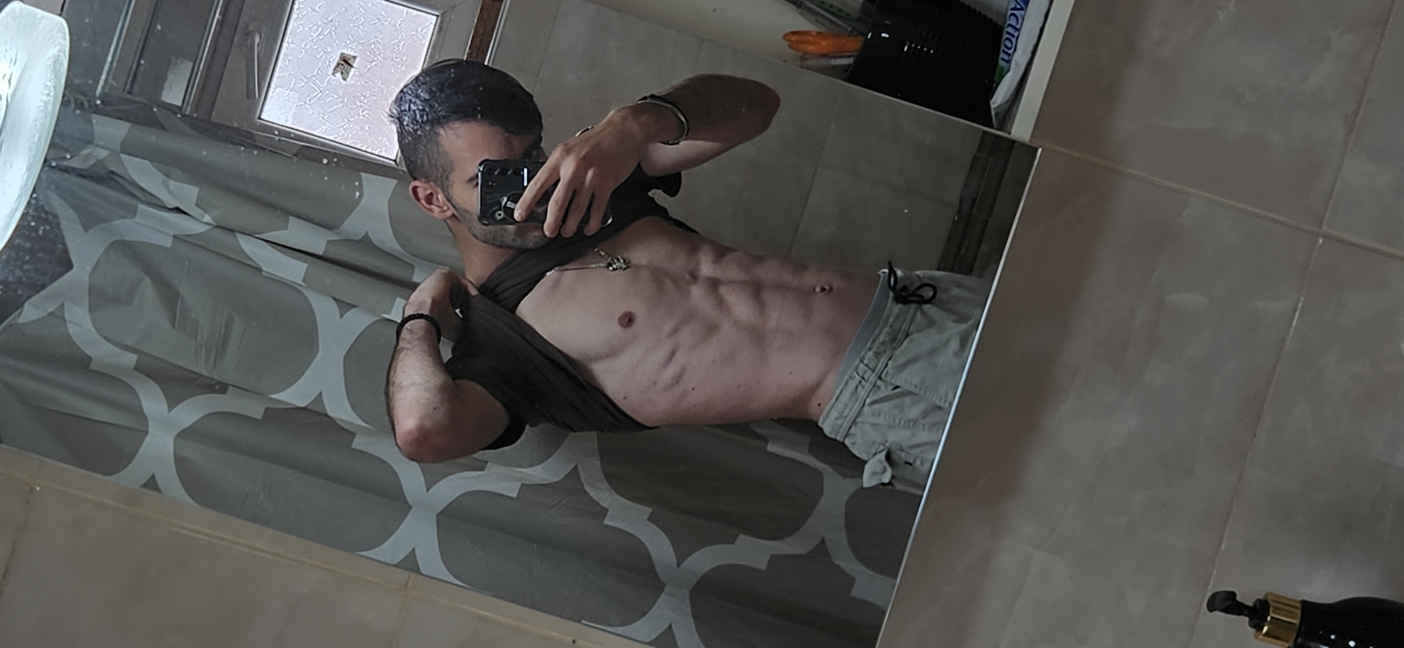 Man Documents Self-Photography Session in Bulgarian Bathroom
