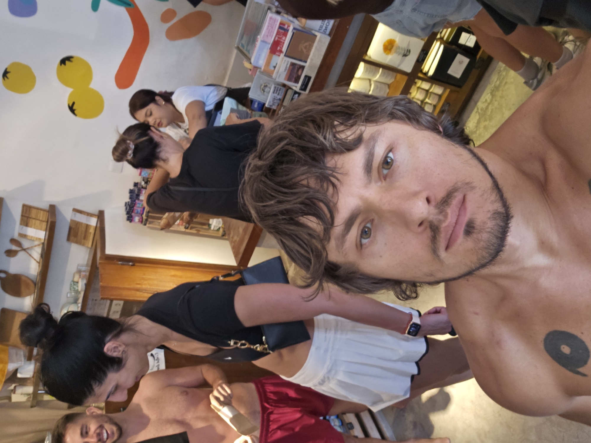 Tourist takes selfie in Tibubeneng shop