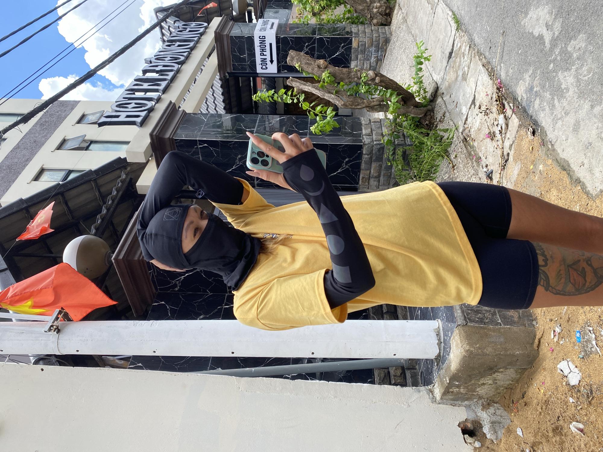 Masked photographer documented near Hotel Dong Nai, Vietnam