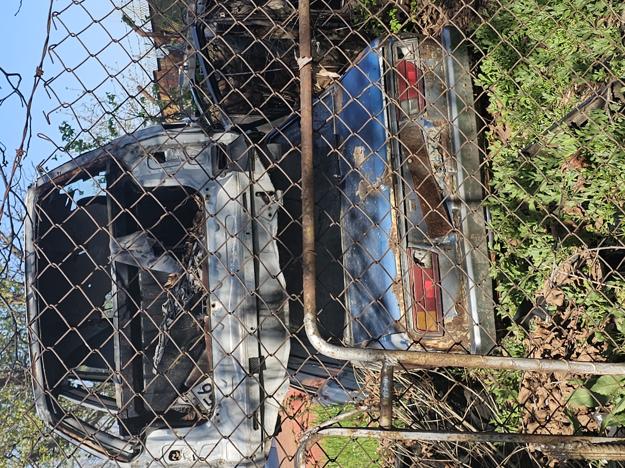 Abandoned vehicles documented behind fence in Plovdiv, Bulgaria