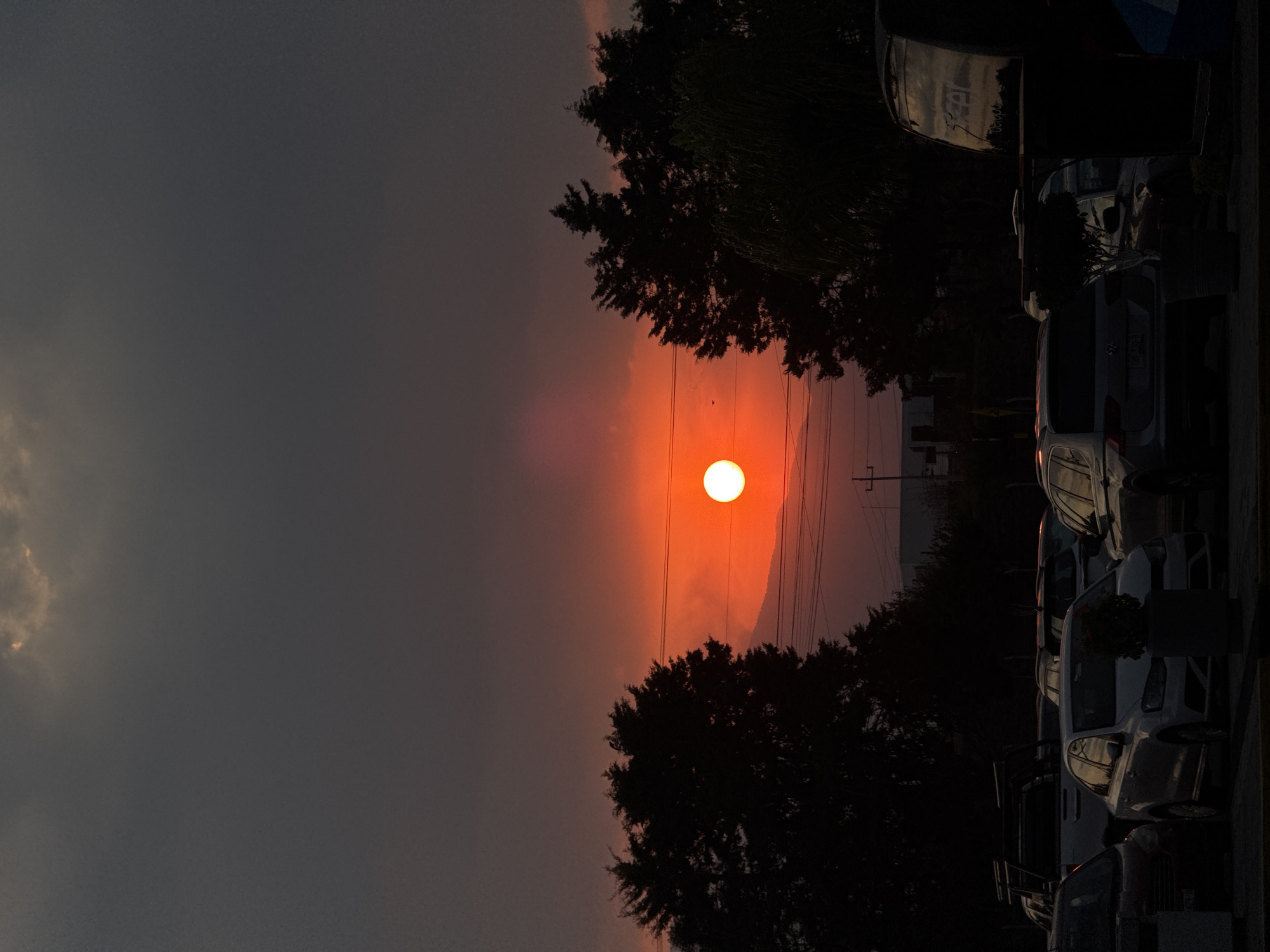 Hazy sunset documented through clouds in Huejotzingo, Mexico
