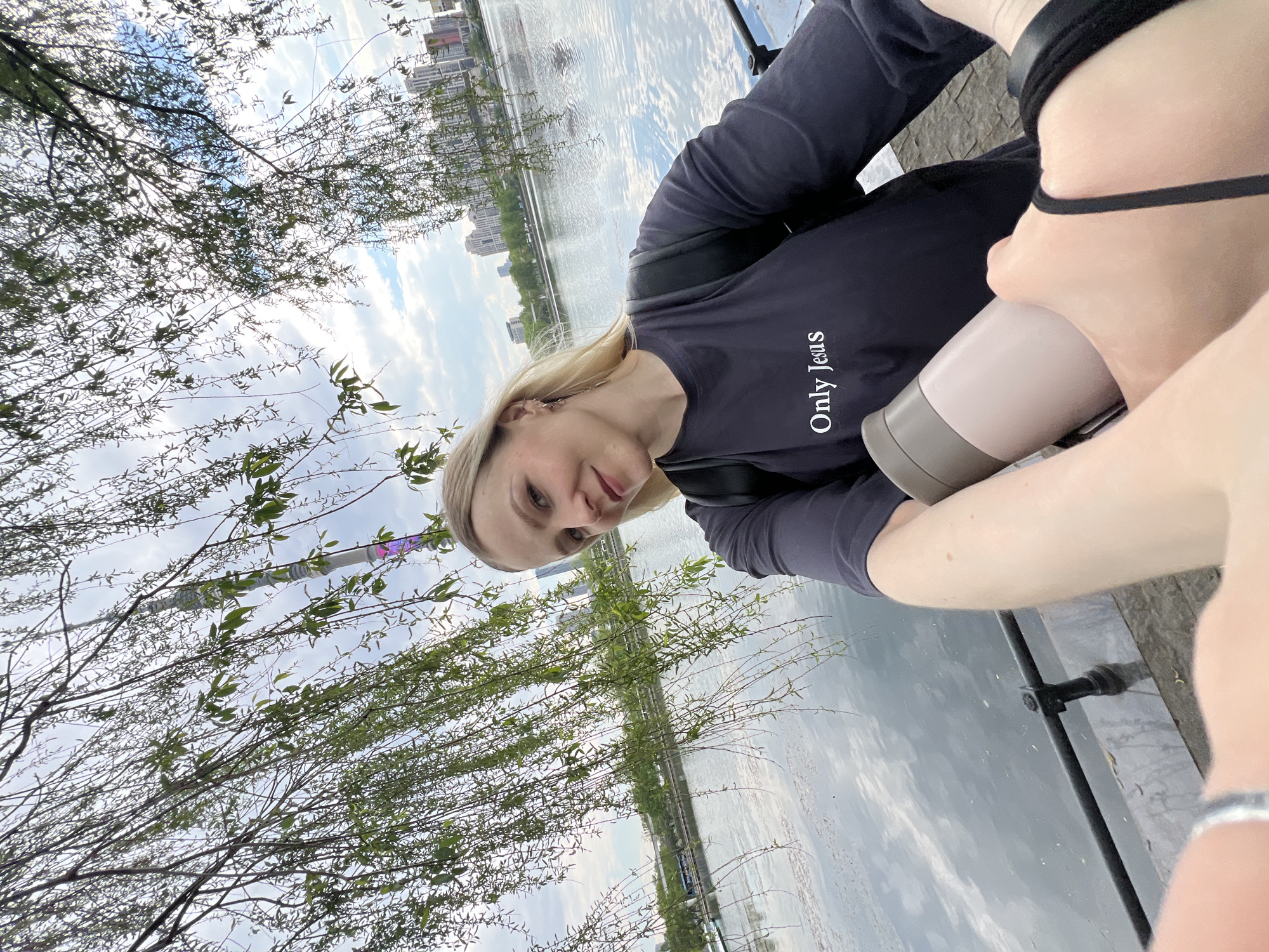 Woman with religious shirt observed near Orthodox church with birds