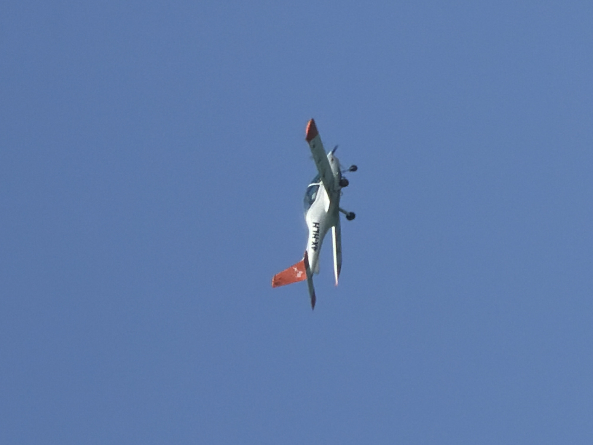 Aircraft and sailboat spotted under clear skies in Tel Aviv