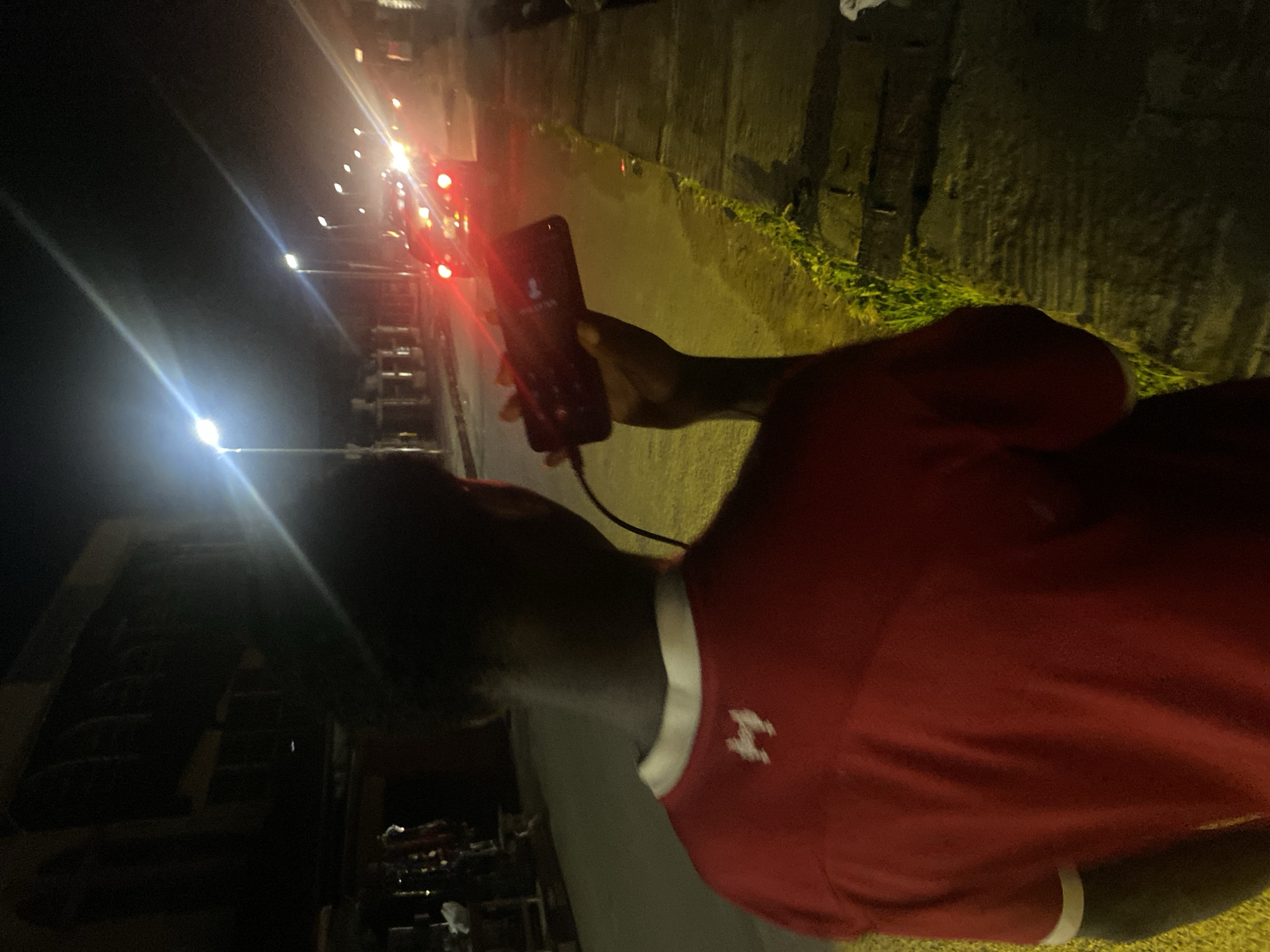 Evening phone call and nighttime street walk observed in Lagos