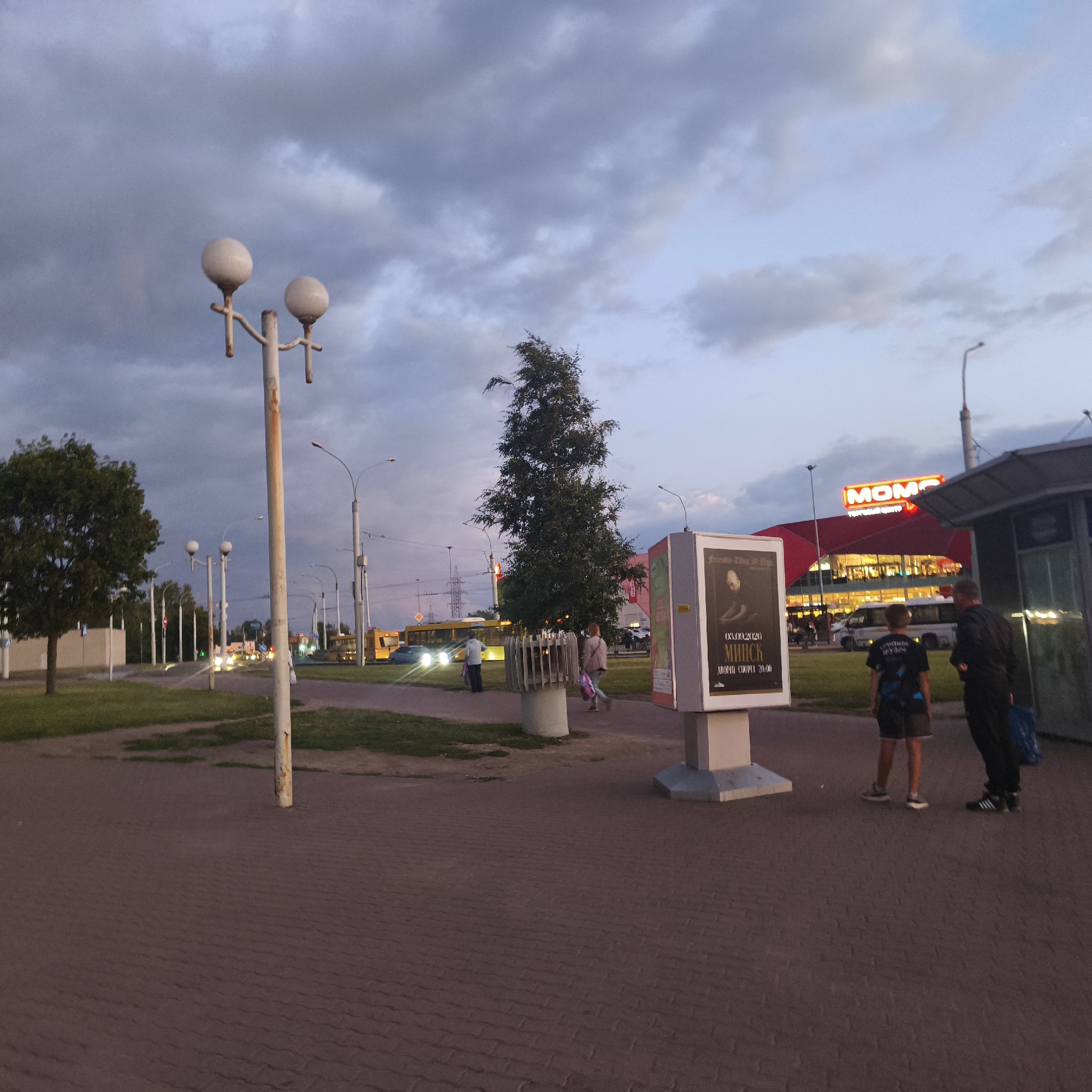 Dusk settles over Minsk streets and commercial signage