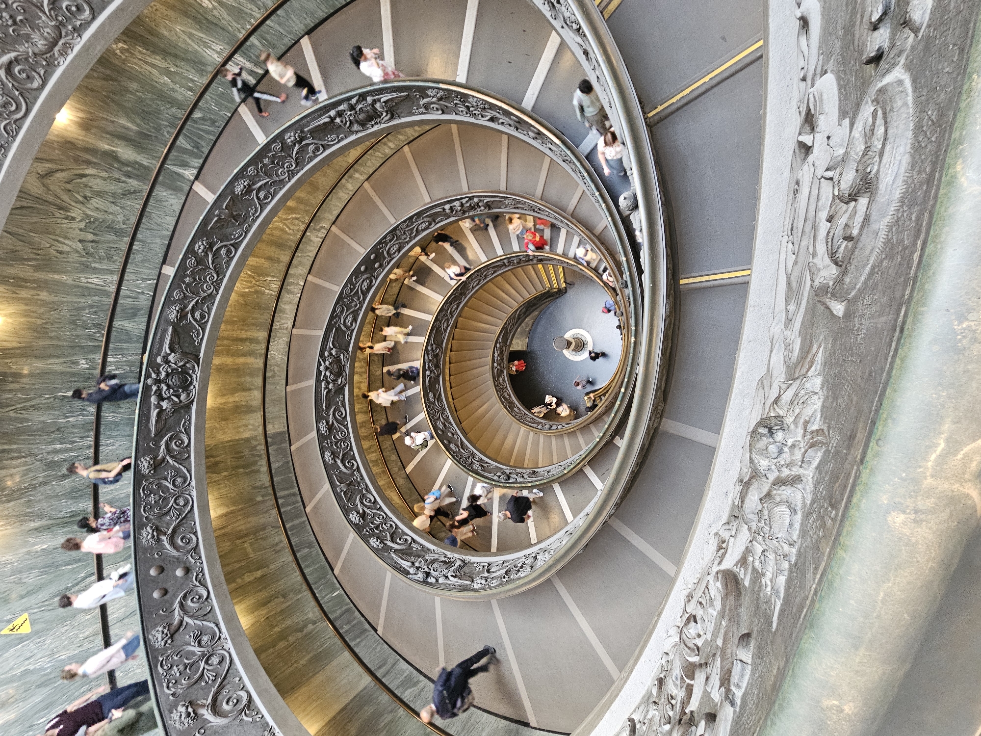 Visitor documents Vatican museum artifacts and sculptures