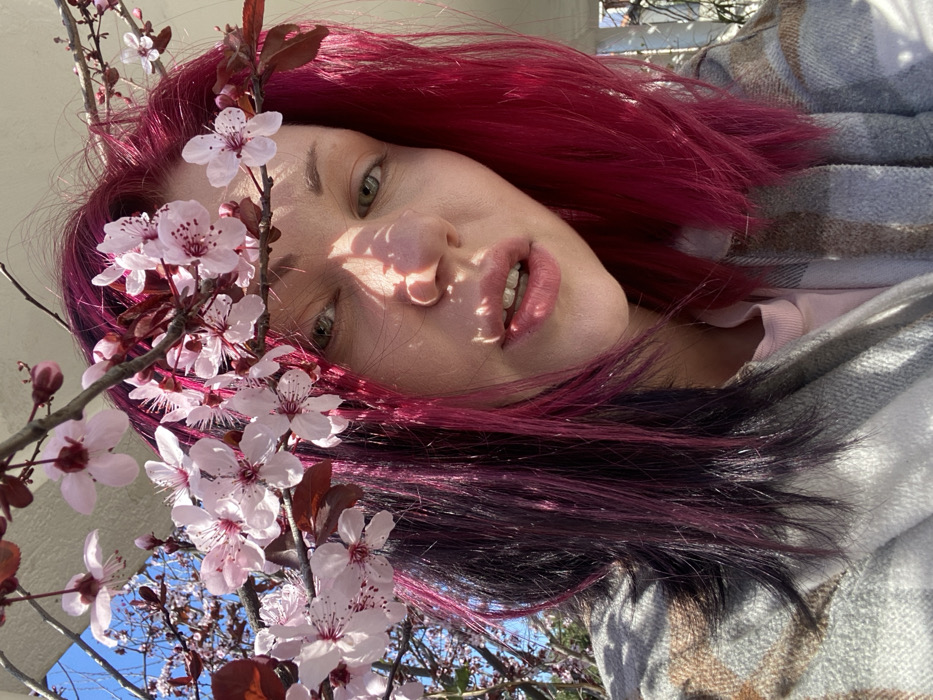 Magenta-haired individual photographed repeatedly in Montenegro village
