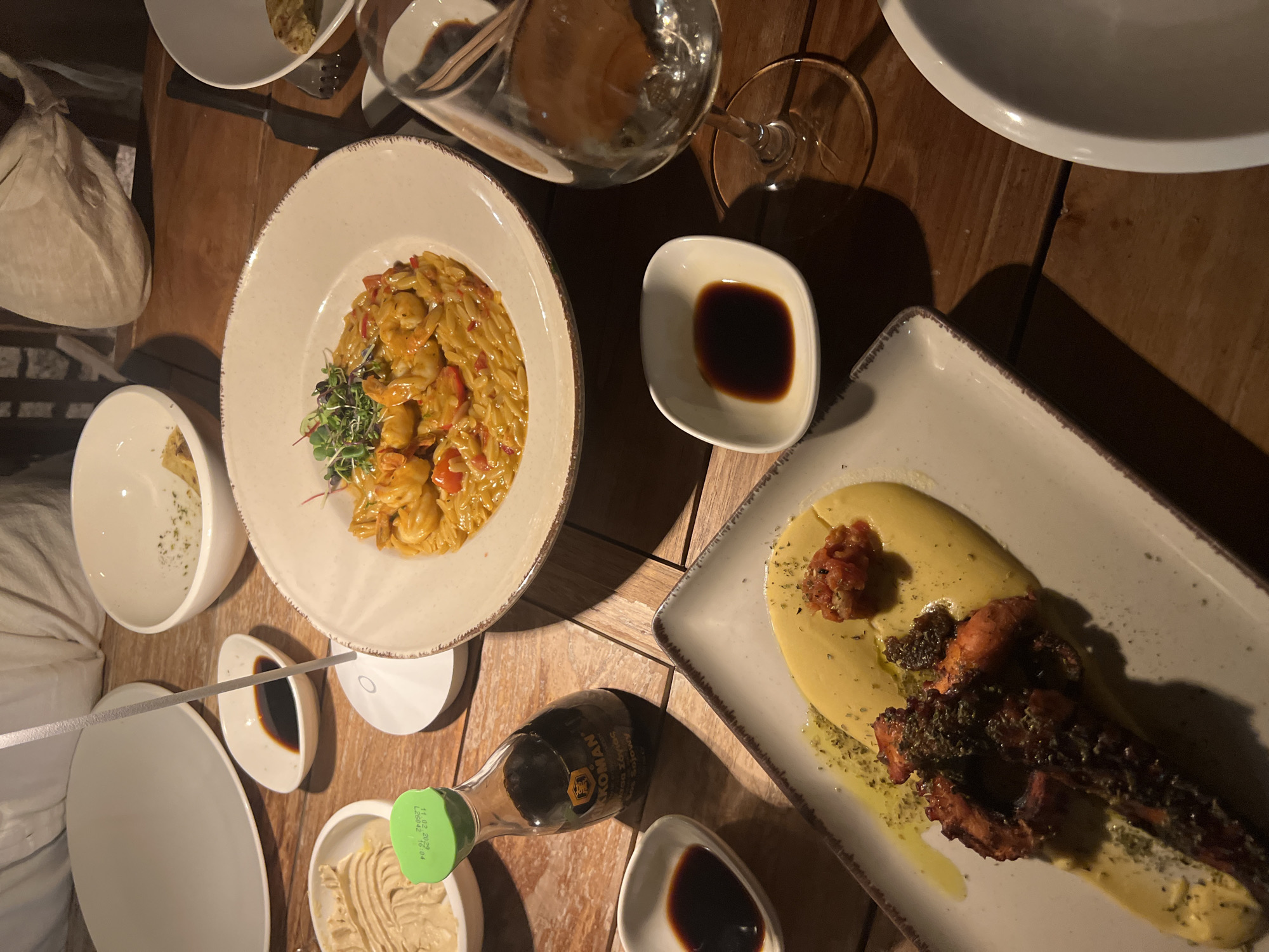 Table full of food and drinks at a Naousa restaurant