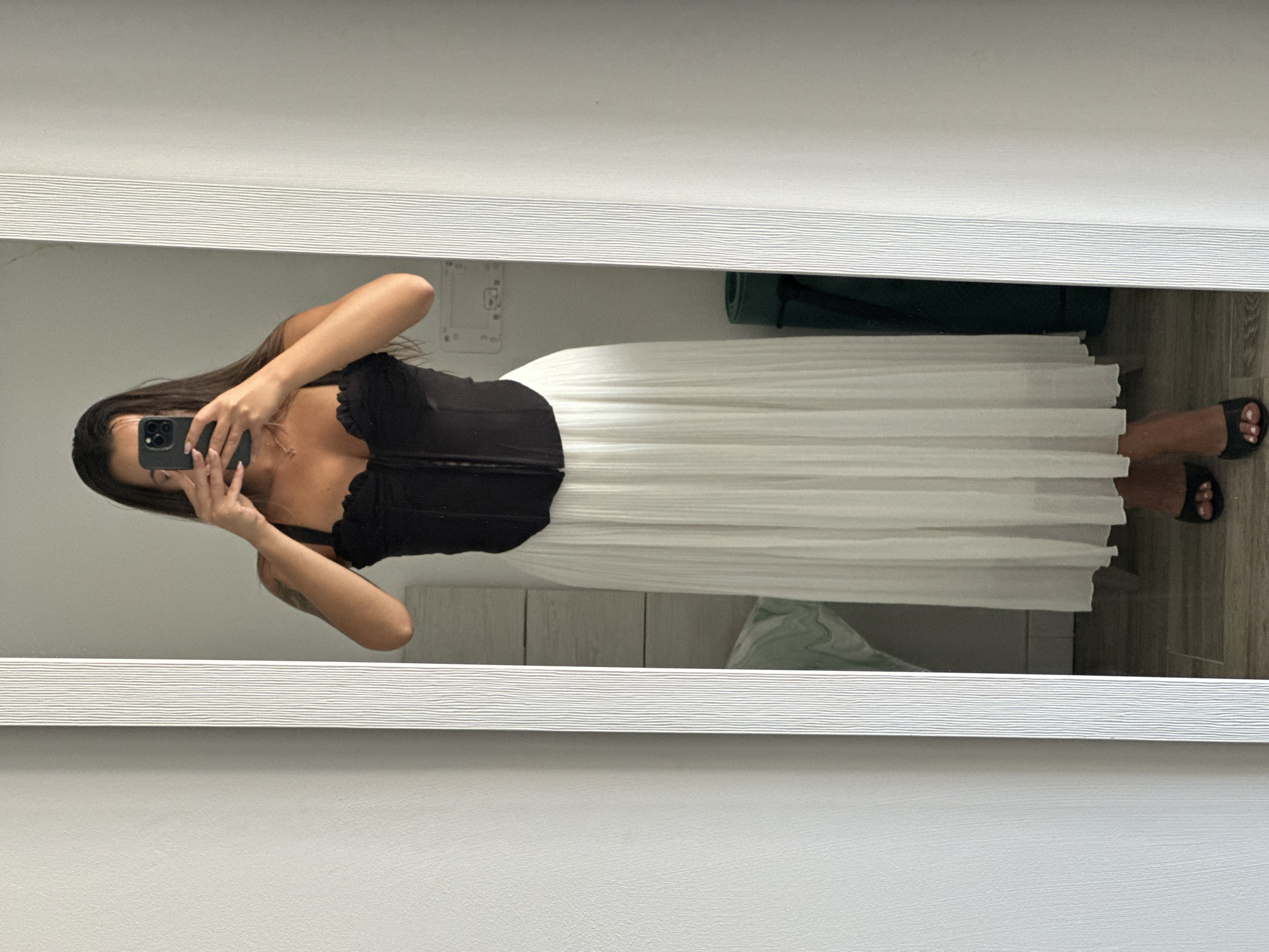Mirror selfie in Torremolinos bedroom, black corset and white skirt