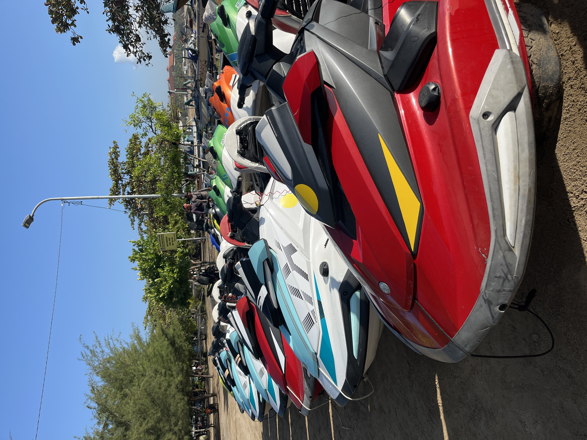Jet ski fleet lines the shore in Kuta Selatan, Bali