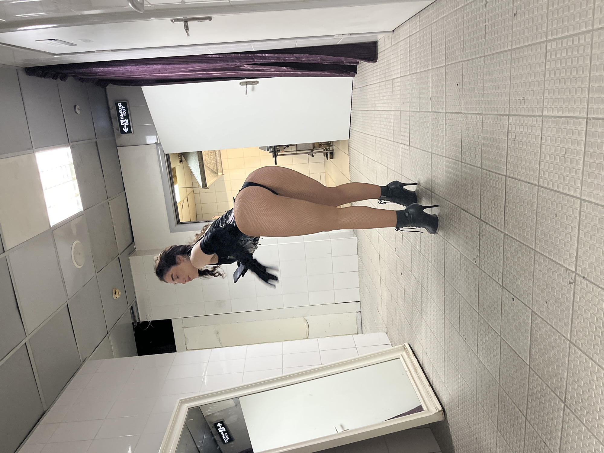 Woman in athletic wear observed in Kazan indoor space