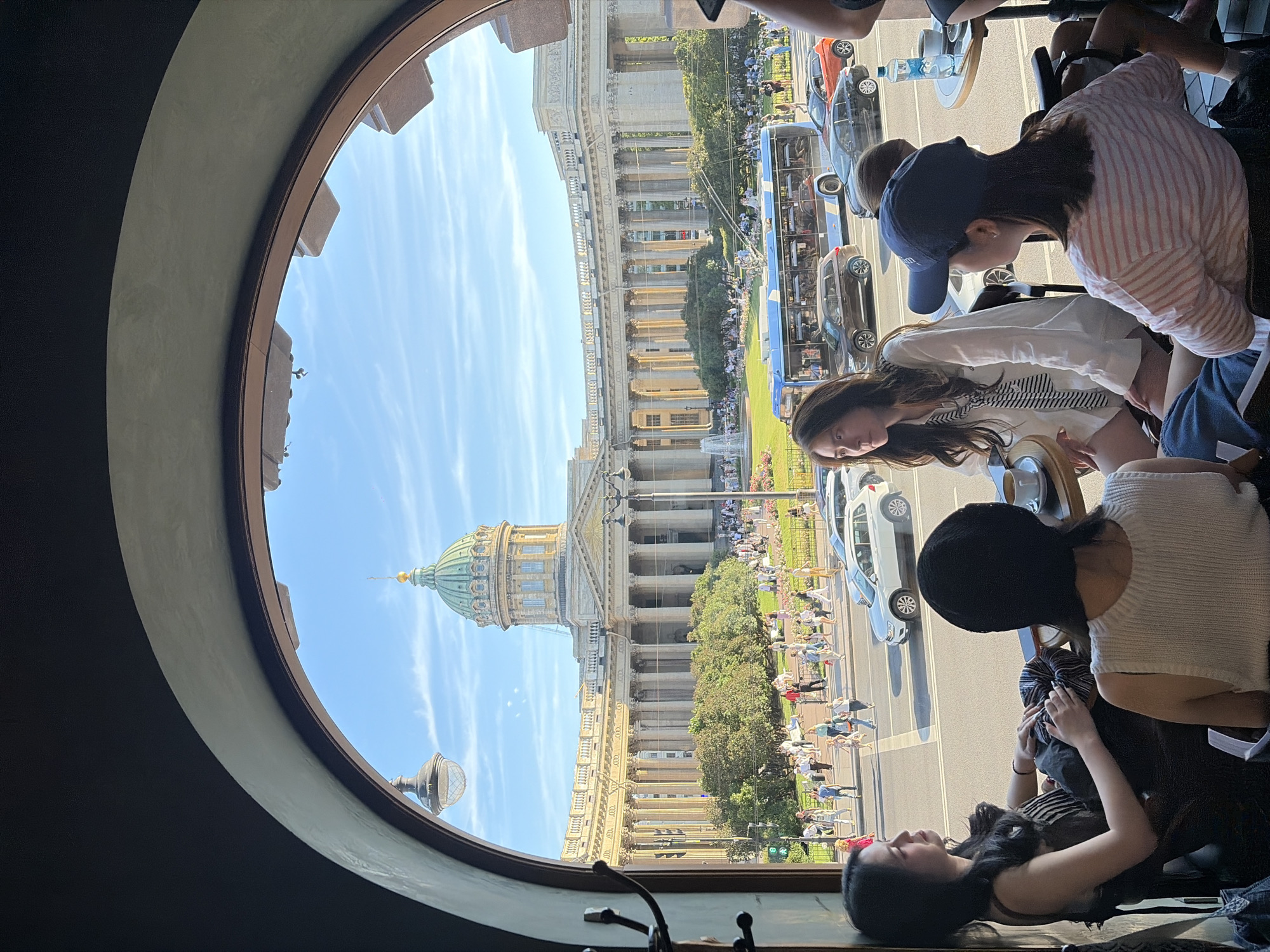 Period costume, paper art, and cathedral views from a St. Petersburg cafe