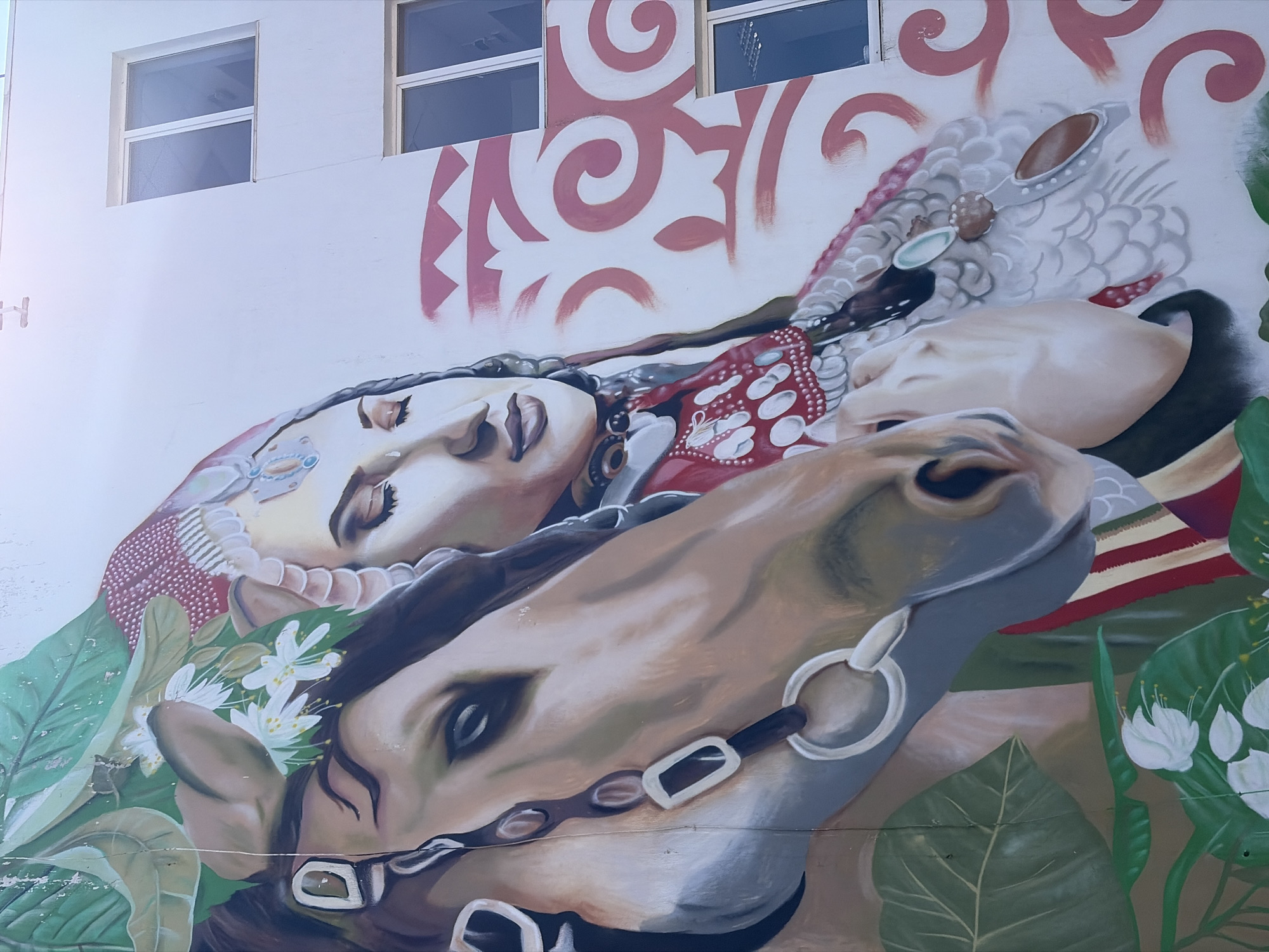 Traditional mural featuring woman and horse observed in Neftekamsk