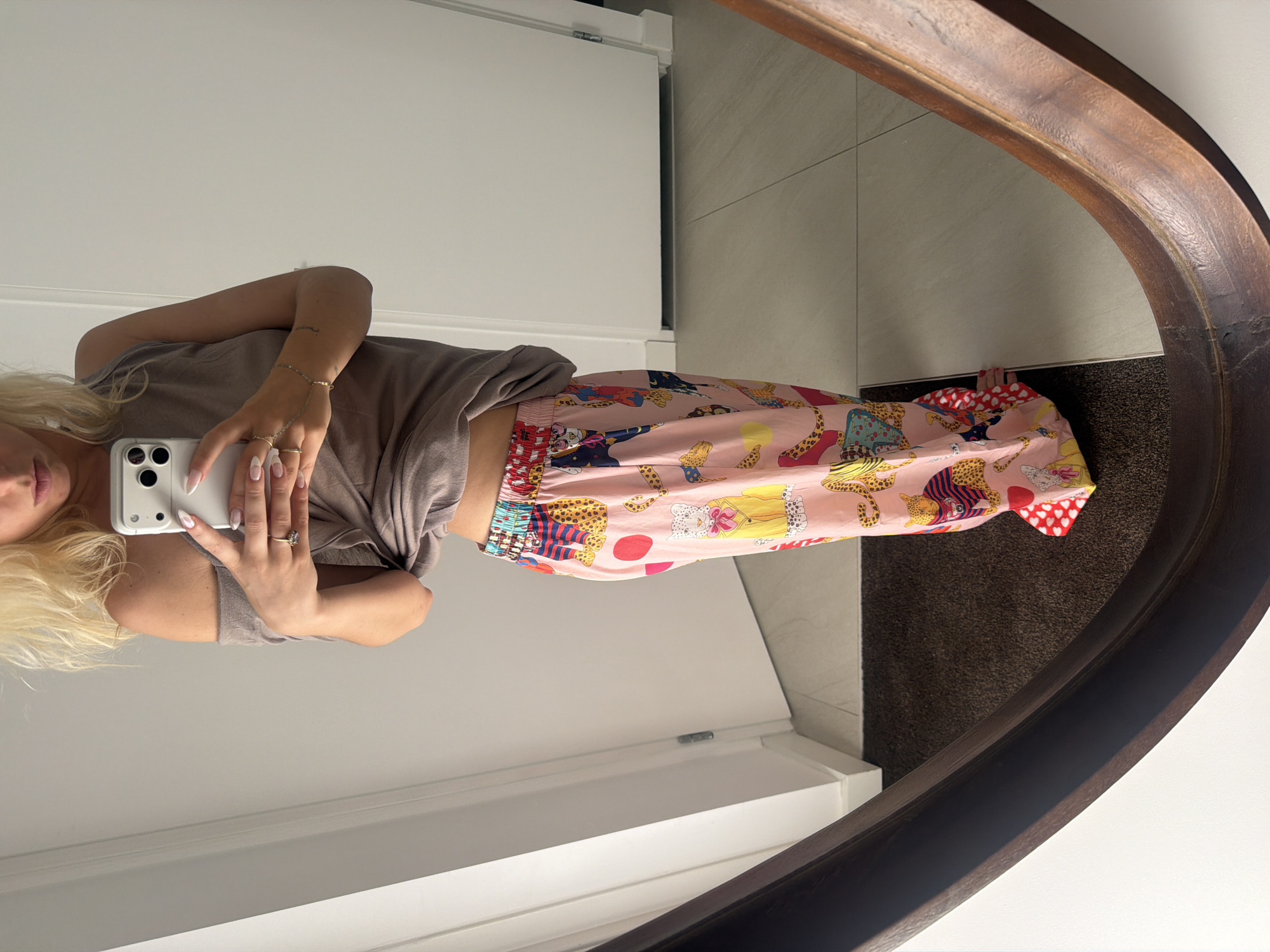Mirror selfie series in a Ridderkerk home, same outfit, three angles.