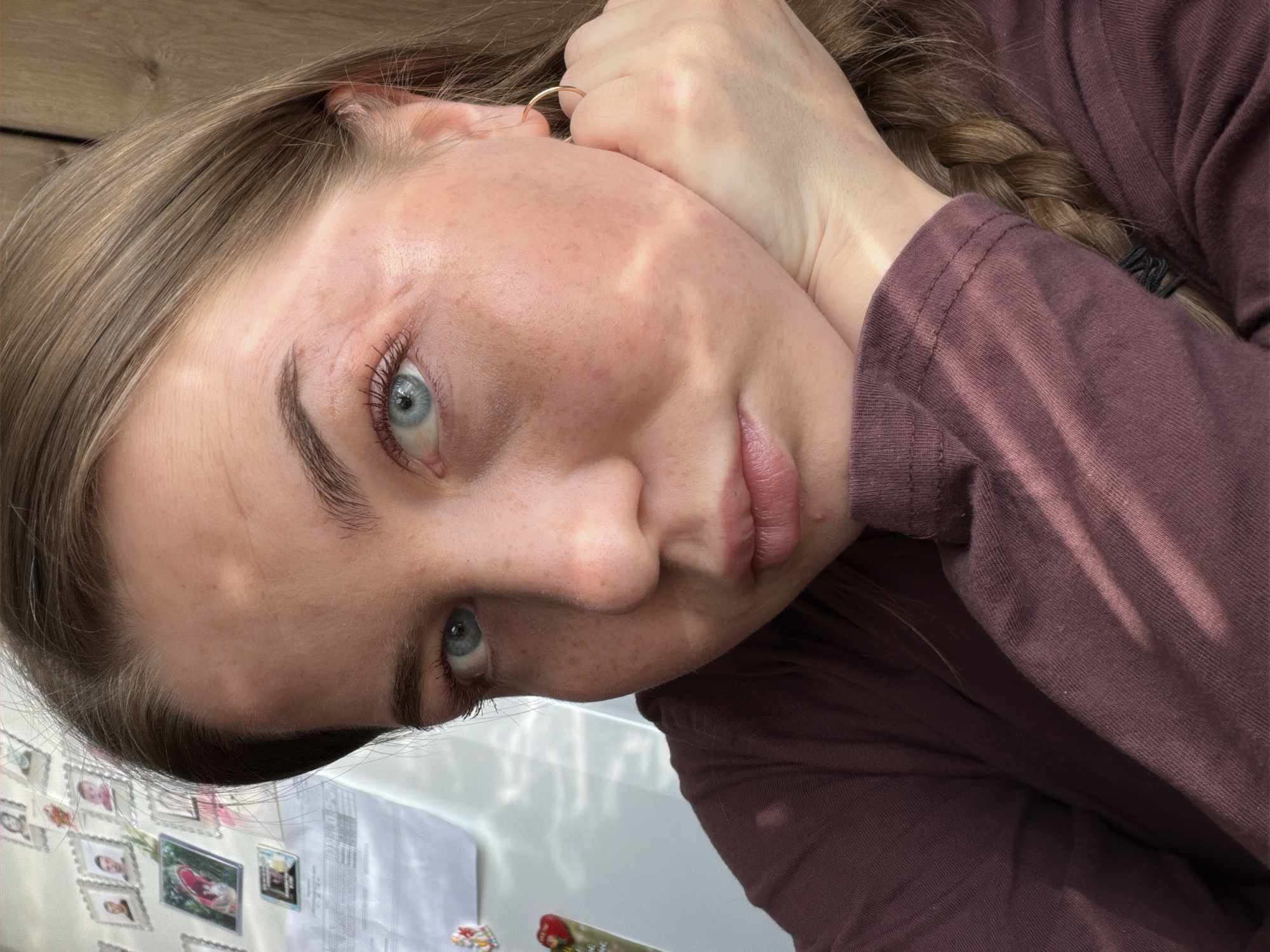 Woman takes selfies, worker handles equipment in Уральское