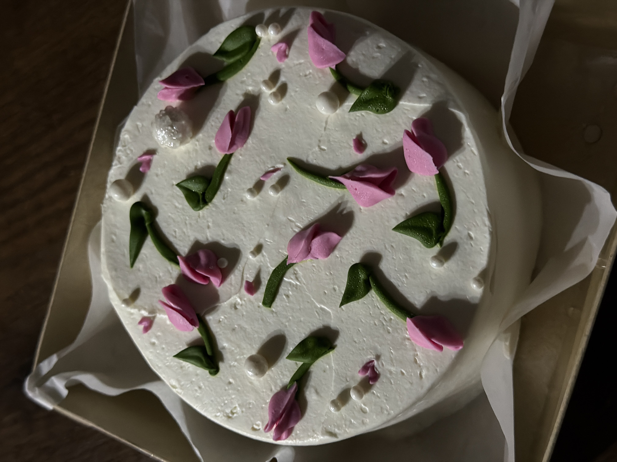 Home celebration with decorated cake and relaxing pets