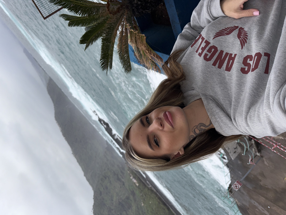 Tourists document stormy coastal scenes at Mesa del Mar