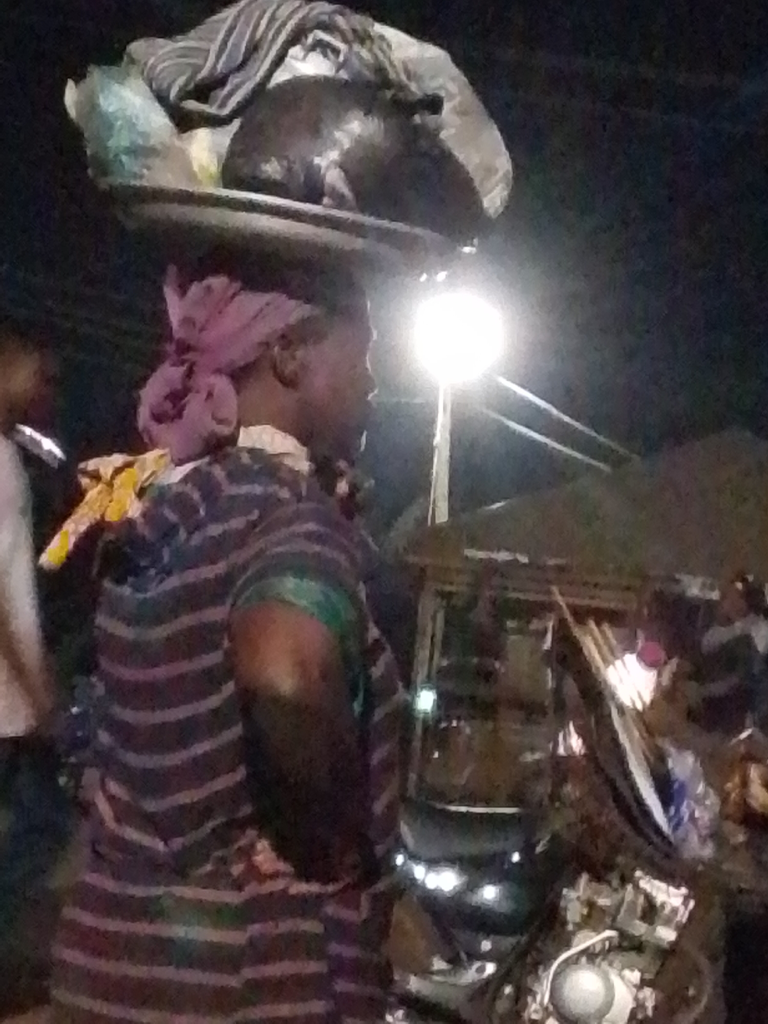 Evening street vendors sell produce in Tamale Ghana