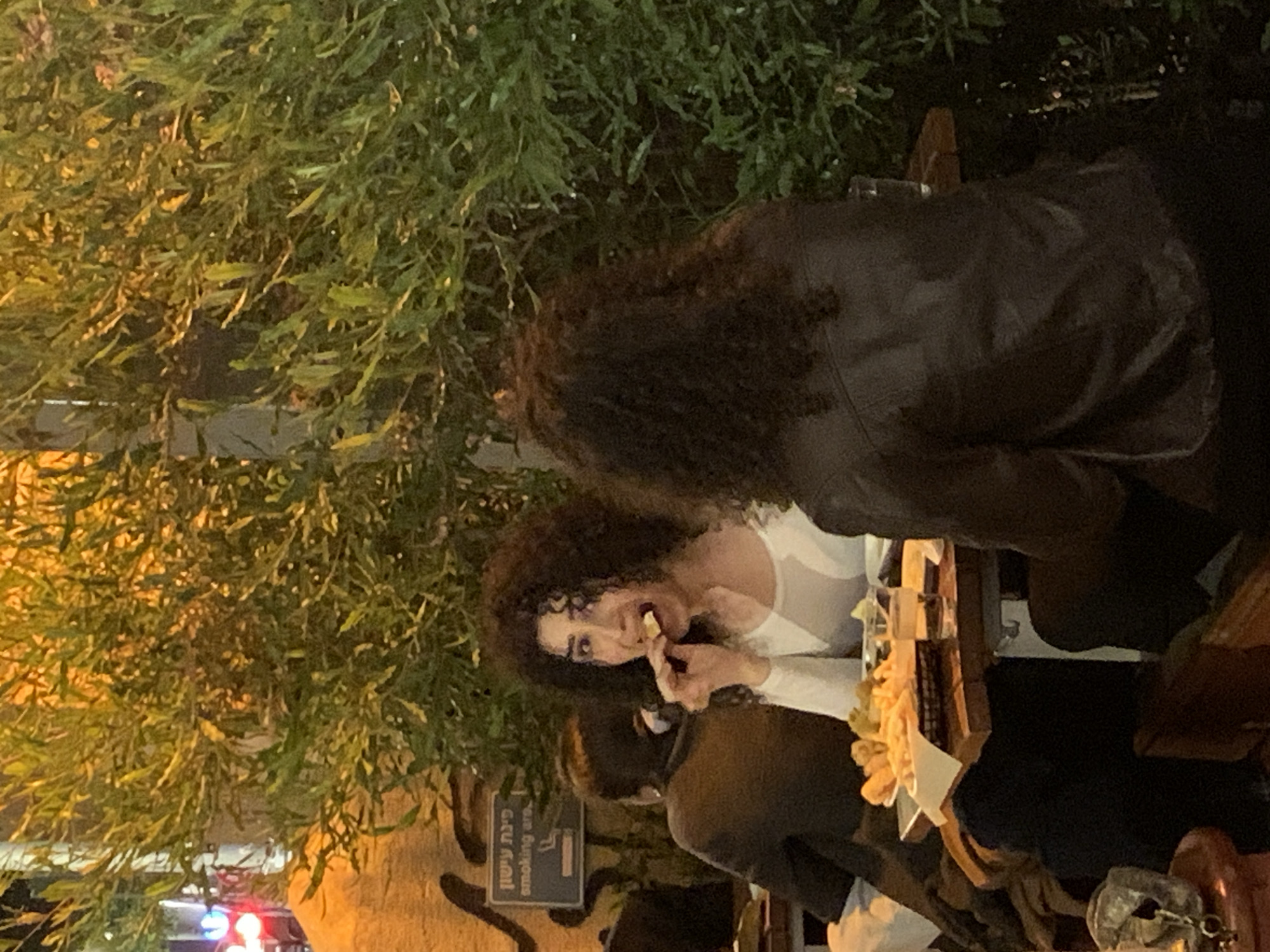 Evening outdoor dining captured at Tel Aviv restaurant