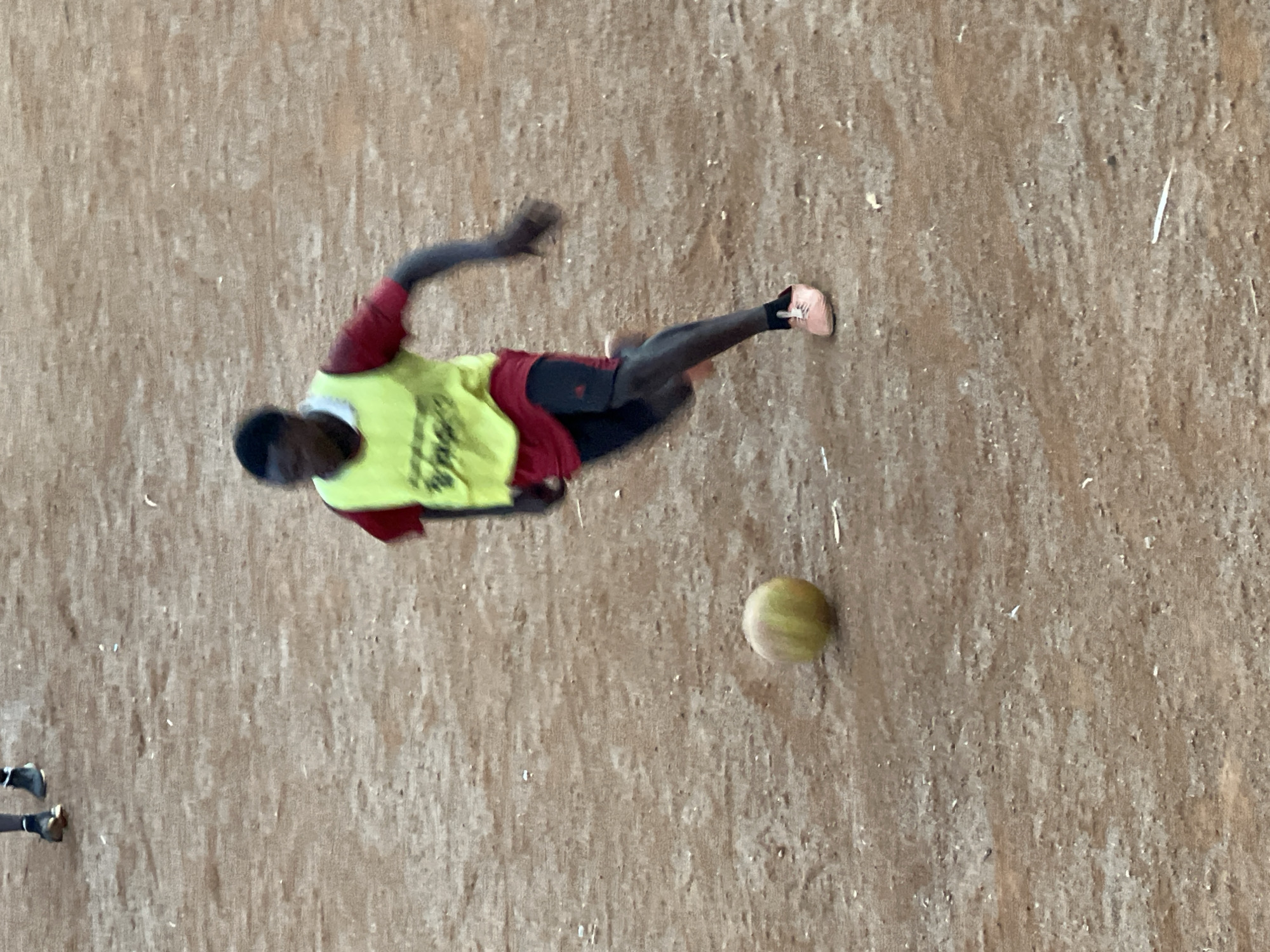 Pickup soccer on a dirt field in Jos, Nigeria