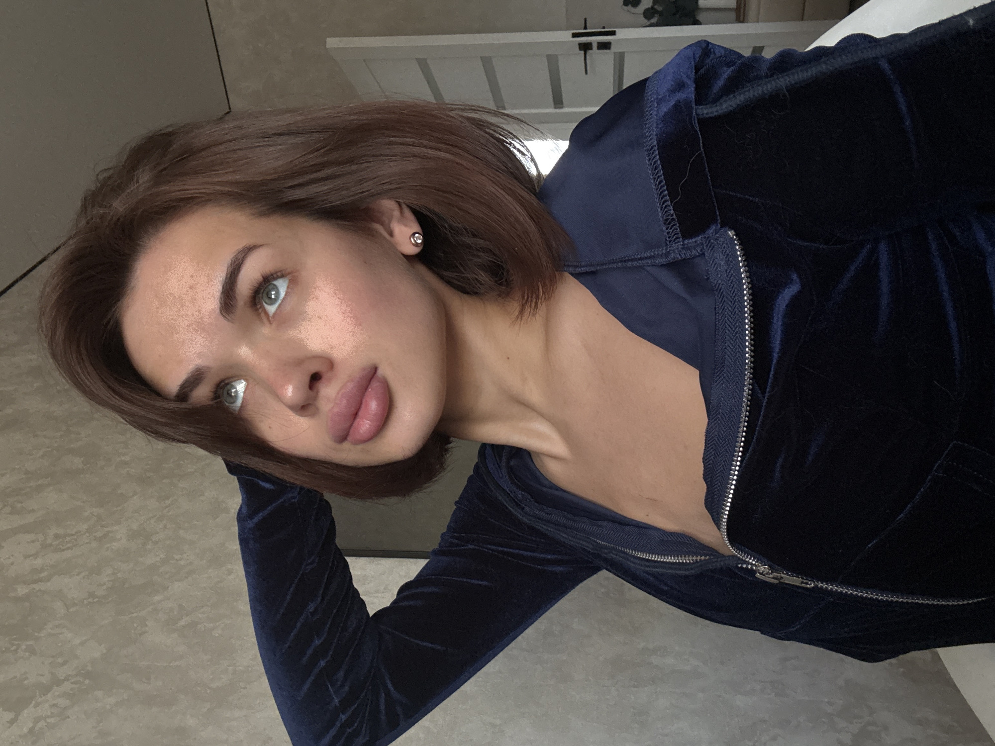 Woman poses for photos indoors in Russian village