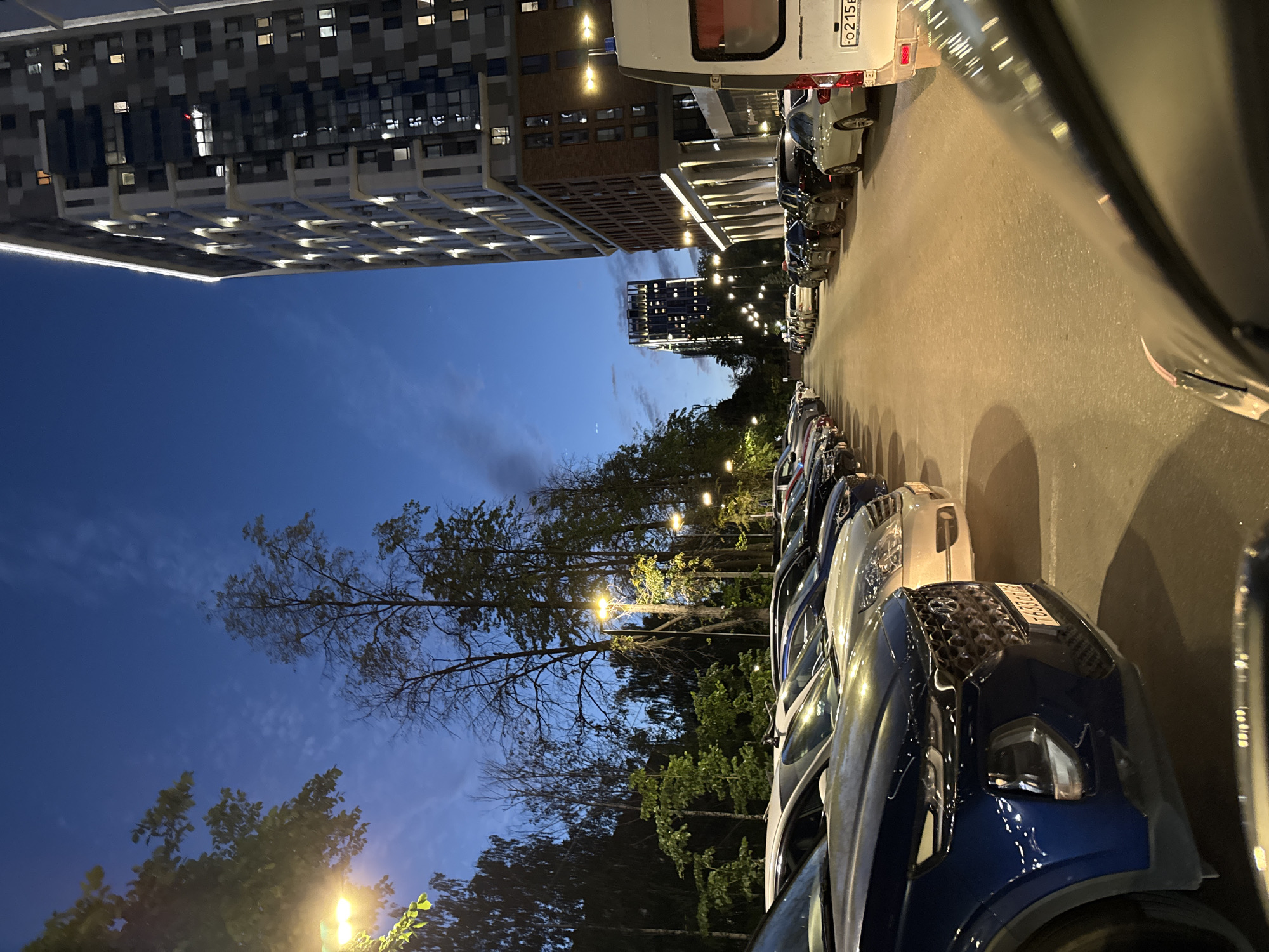 Izhevsk residential parking lot at dusk, evening light