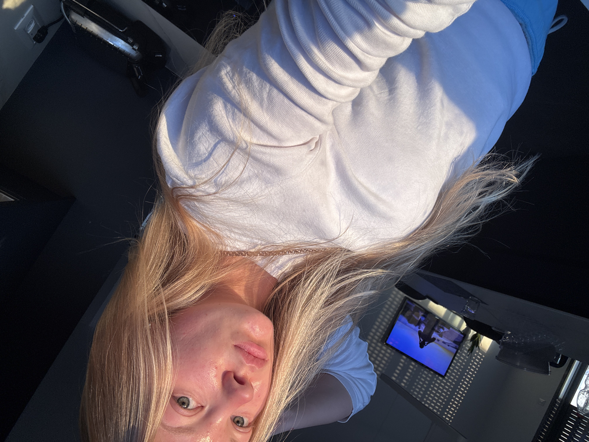 Woman photographed in casual indoor settings in Ariel