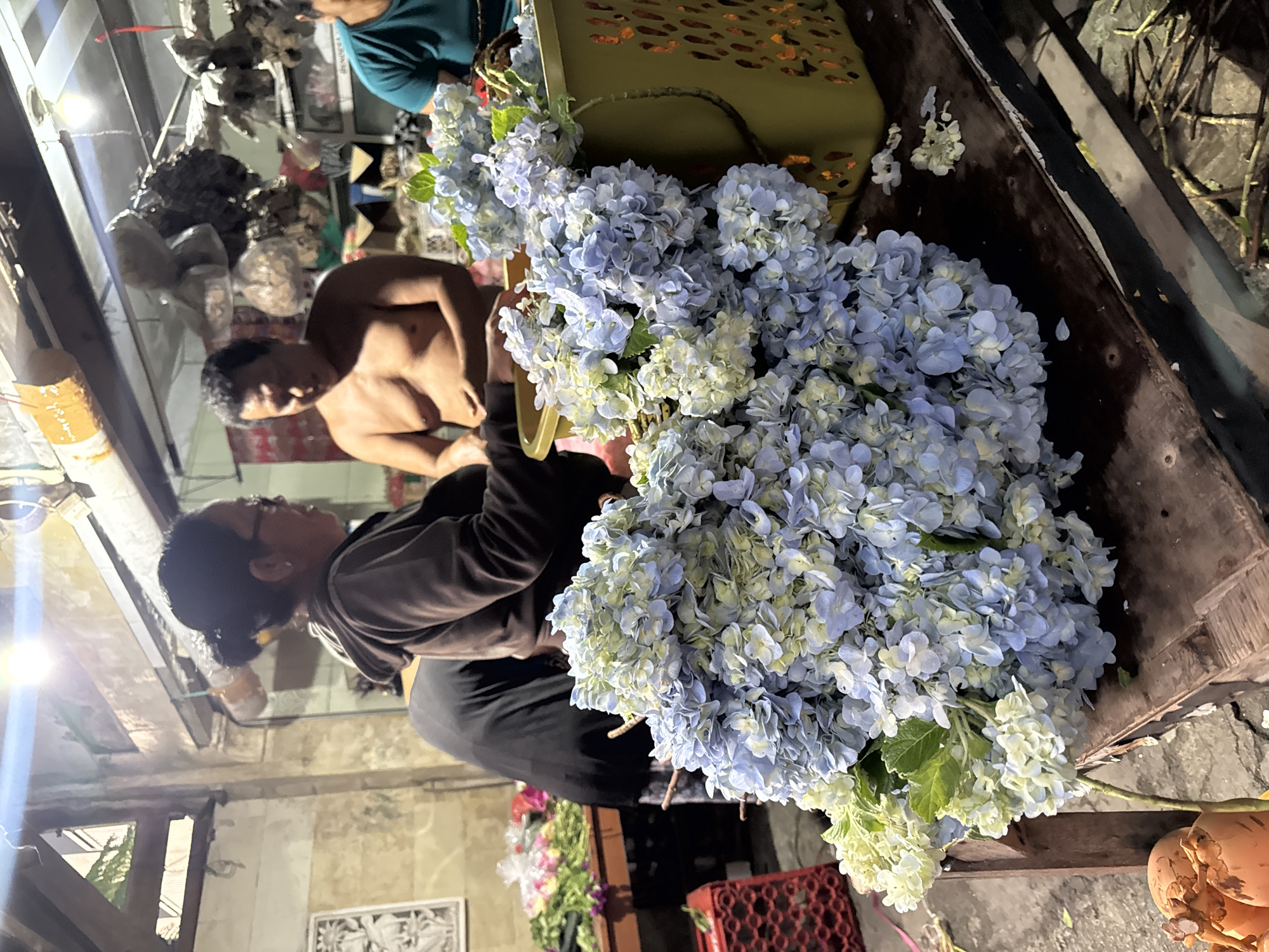 Evening flower market activity captured in Kuta, Indonesia