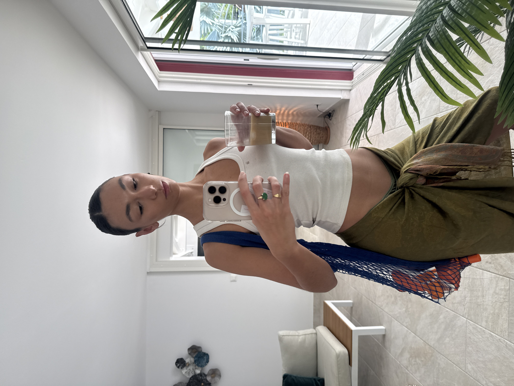 Young woman takes mirror selfies in Saint-Martin, France