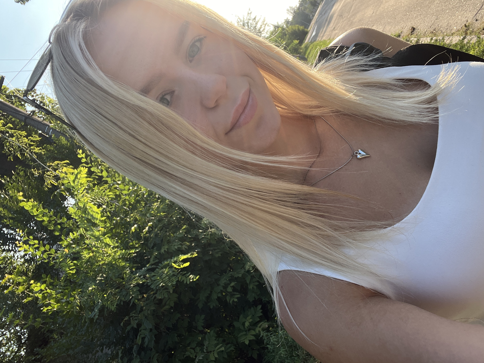 Outdoor selfie series on a sunny tree-lined path