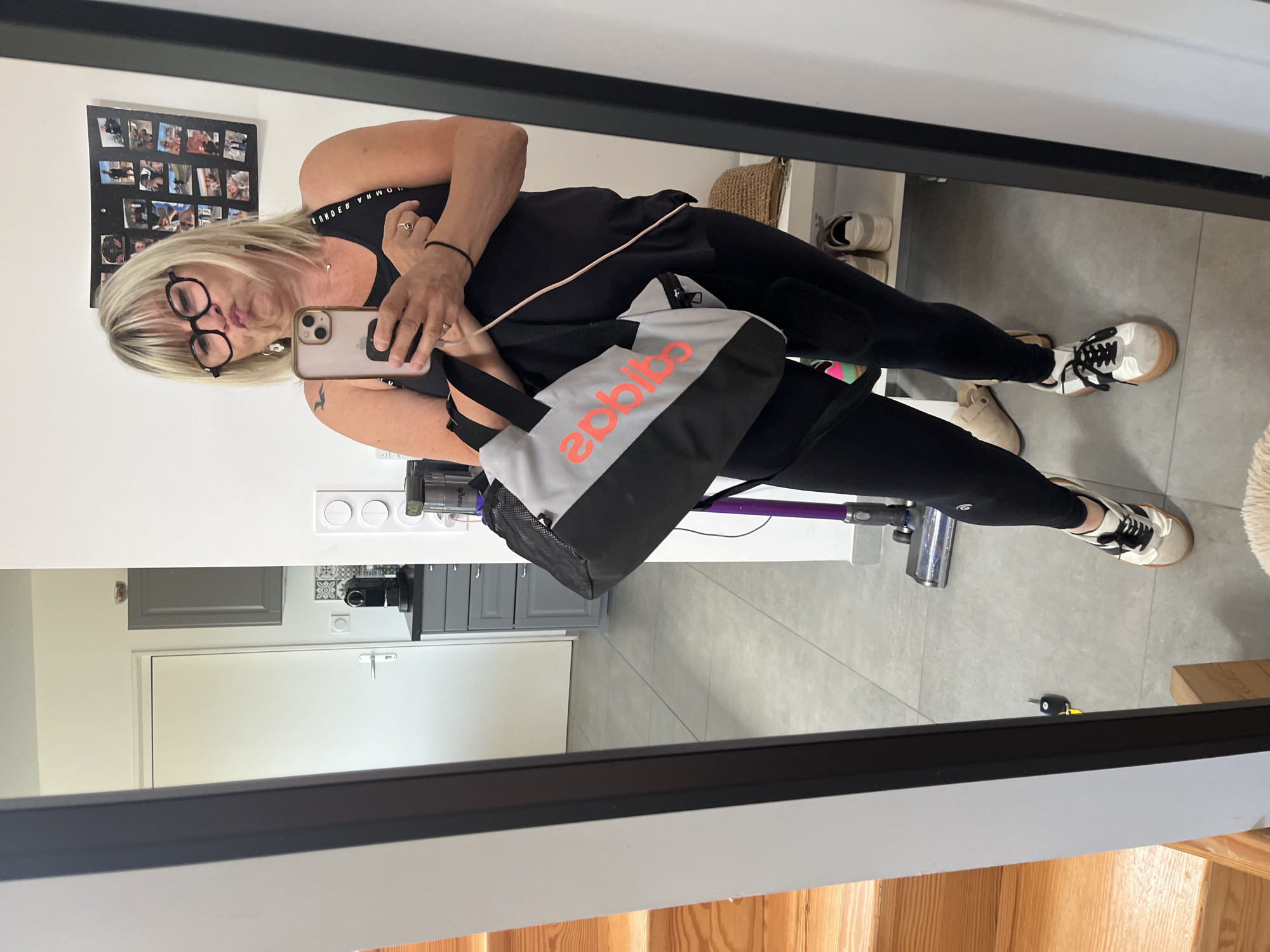 Woman takes mirror selfie in Chambœuf indoor location