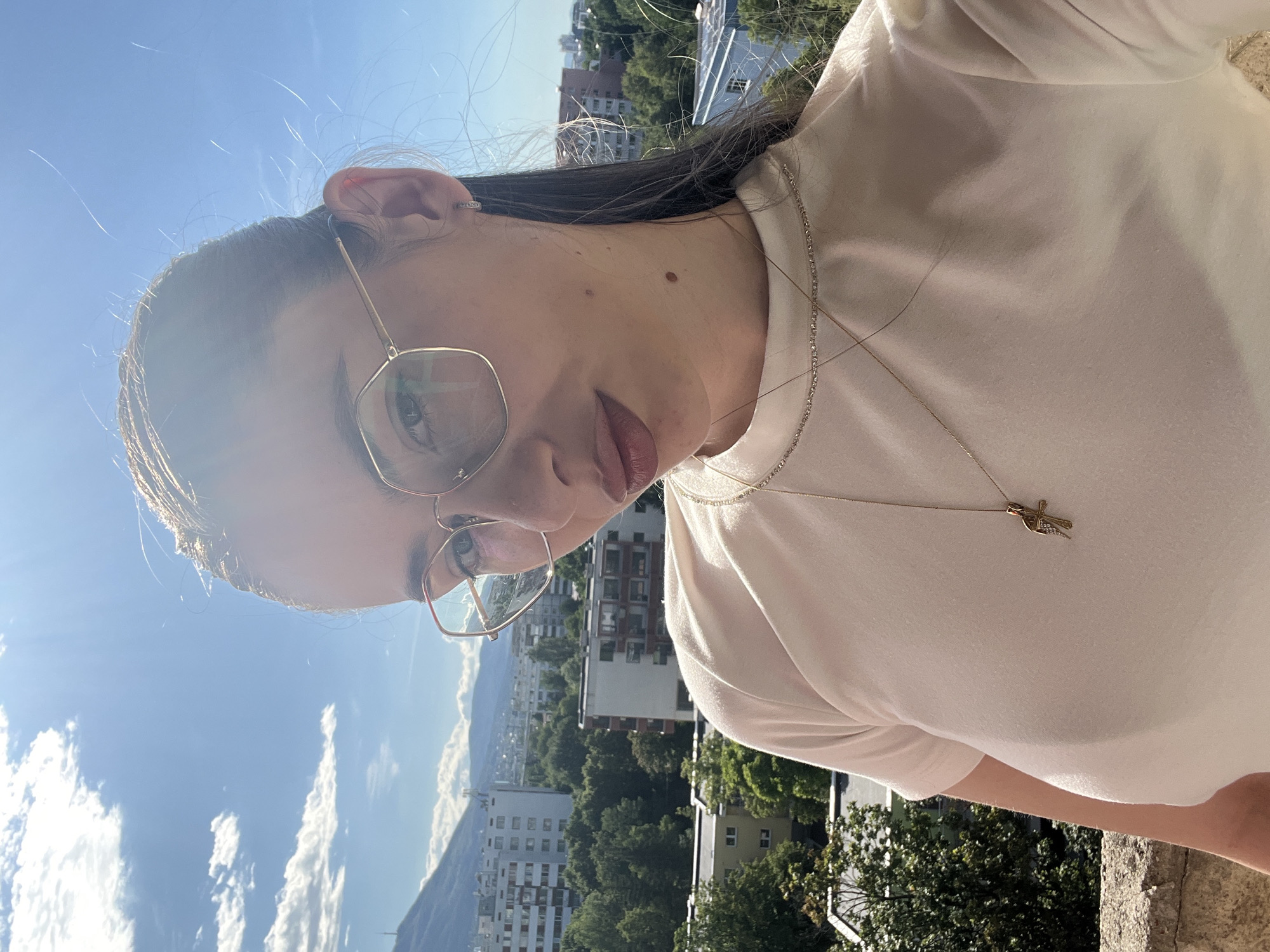 Balcony selfie session above a city skyline