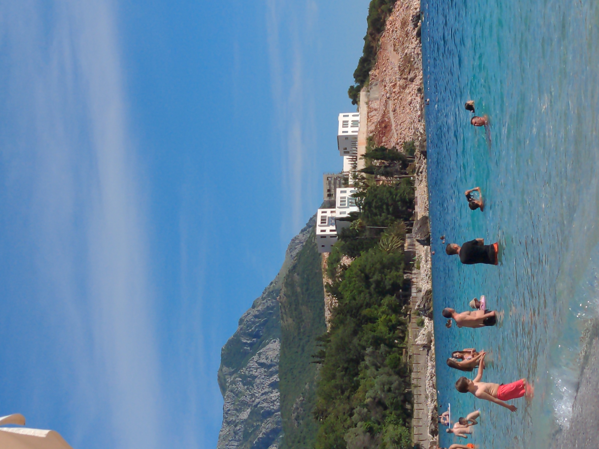 Beach day activities documented at Mediterranean coastal resort location