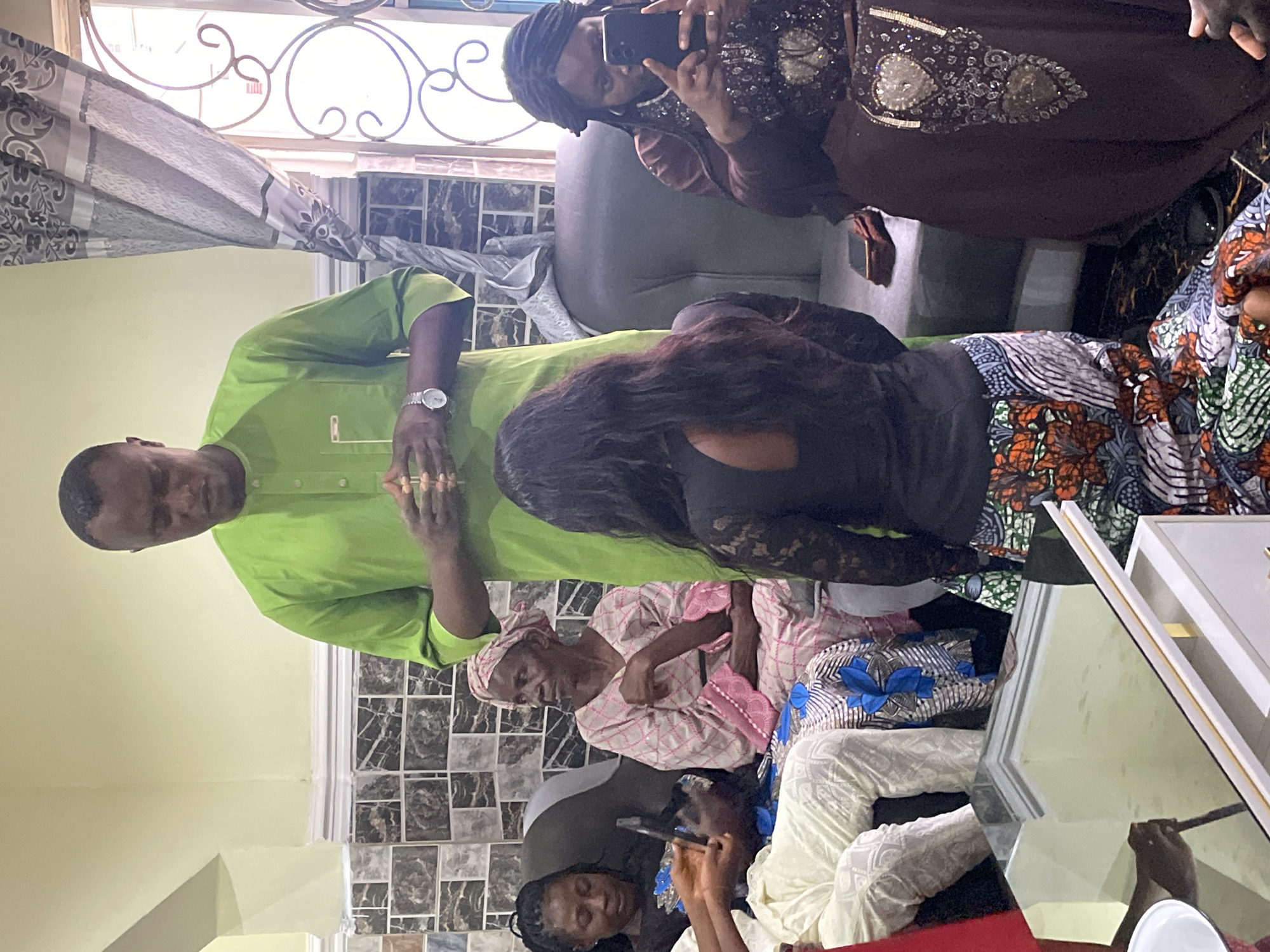 Family celebration at Nigerian home spans indoor and outdoor spaces