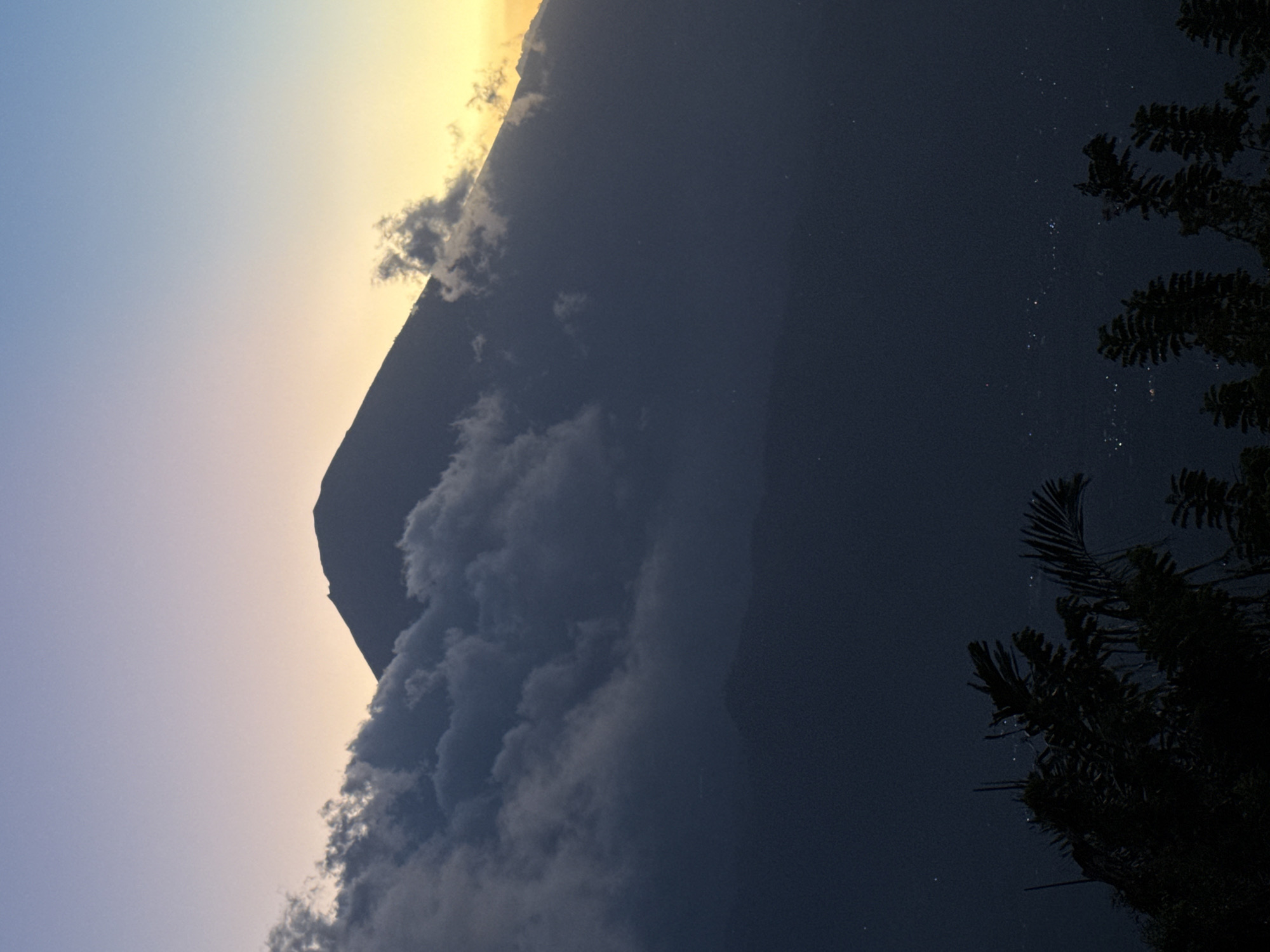 Mount Agung silhouetted at dusk in Abang, Indonesia