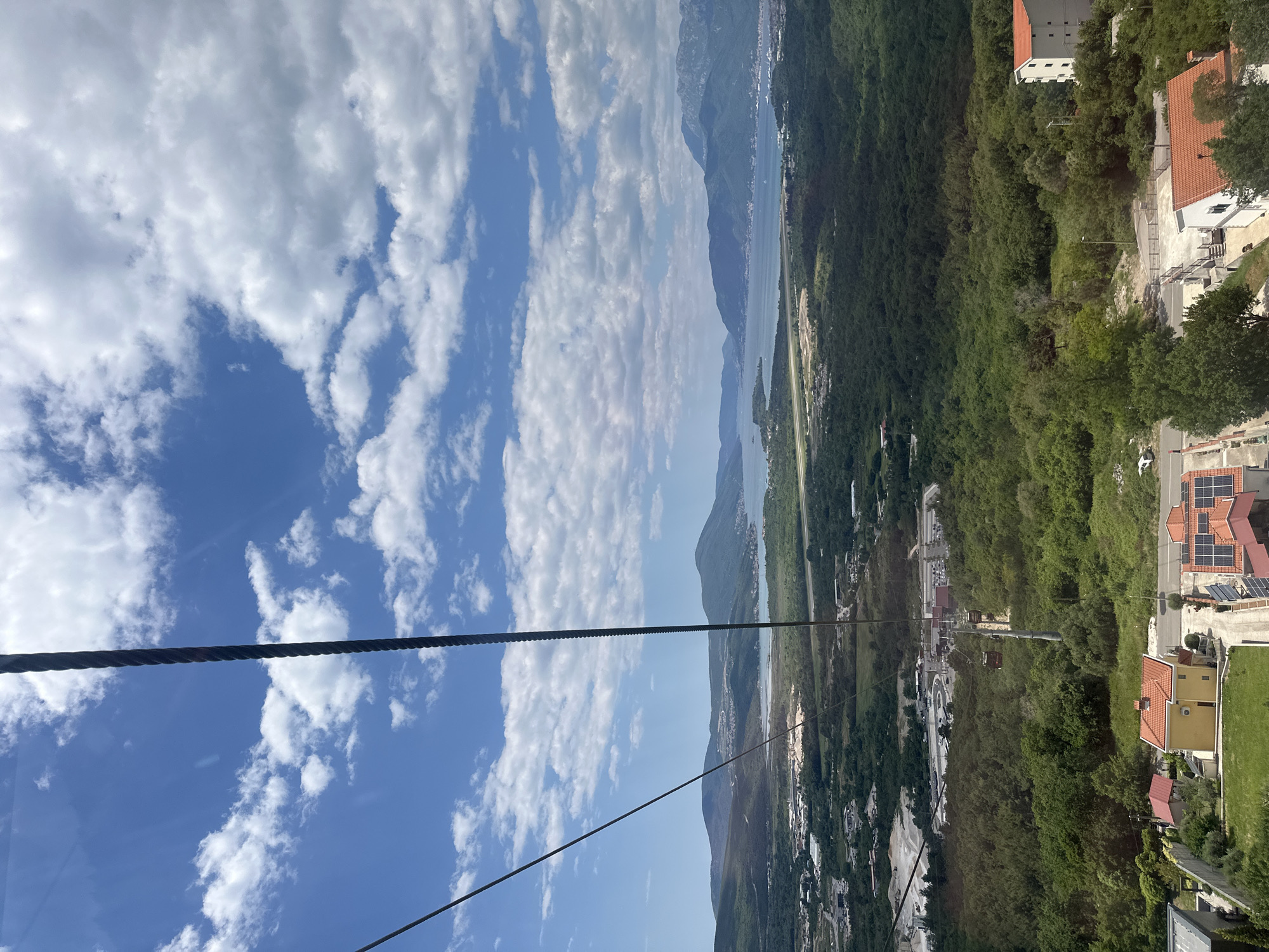 Tourists ride Kotor Cable Car to scenic Dub station