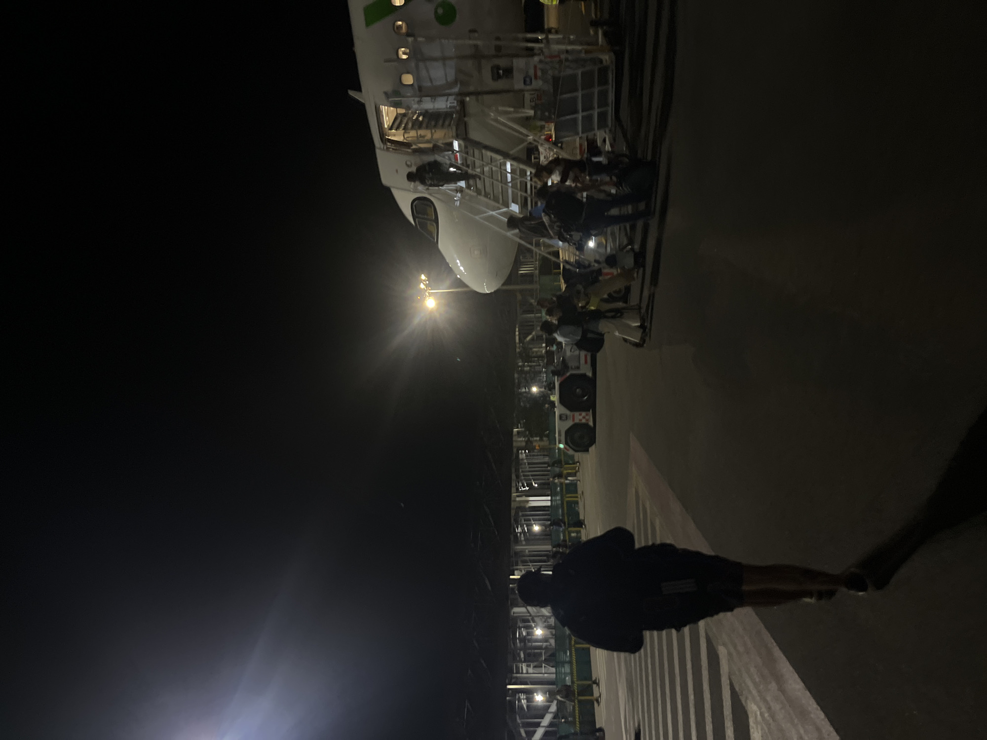Night arrival at Puerto Escondido airport with passenger disembarkation