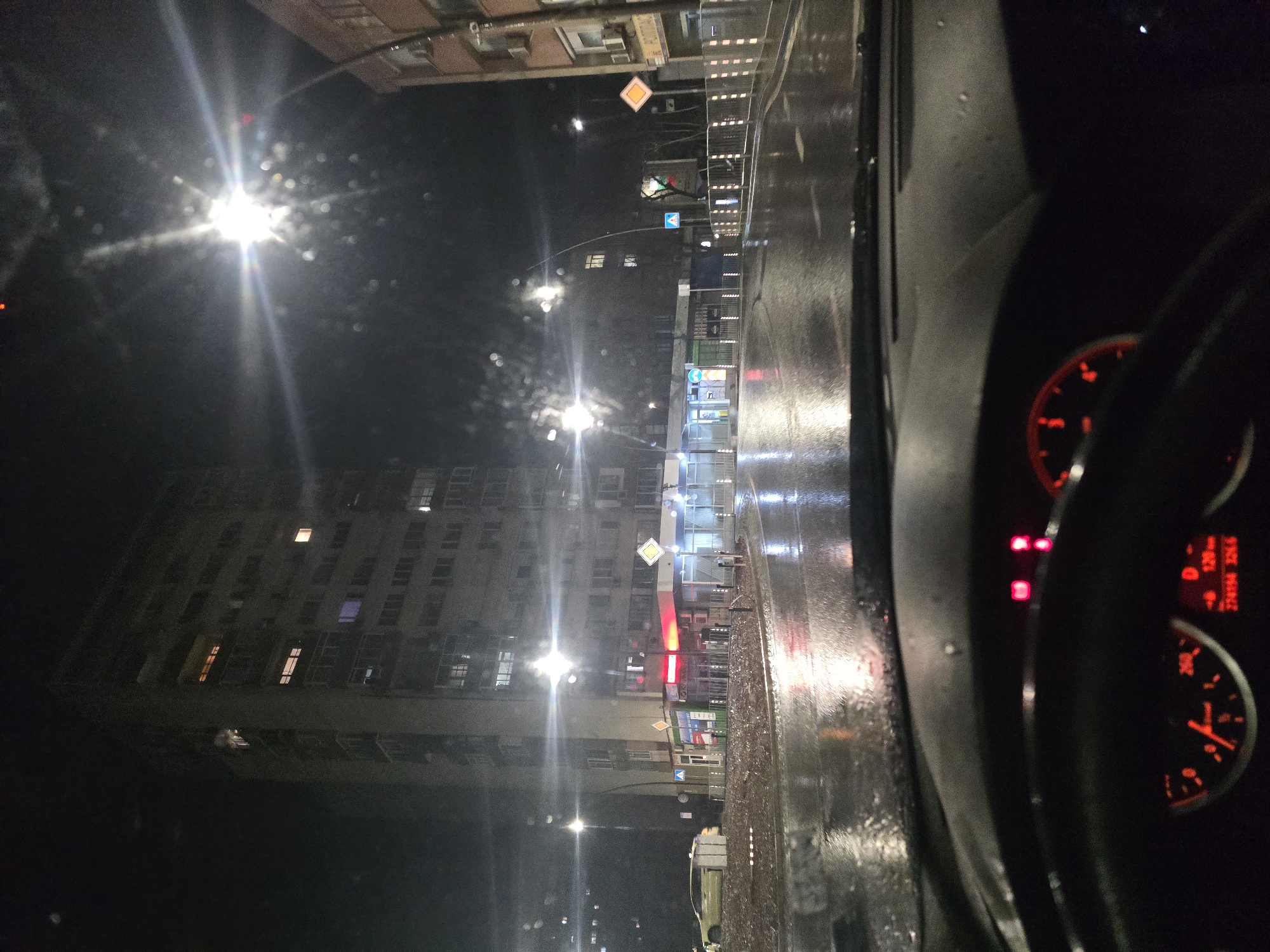 Rainy night drive captured through streets of Yambol, Bulgaria