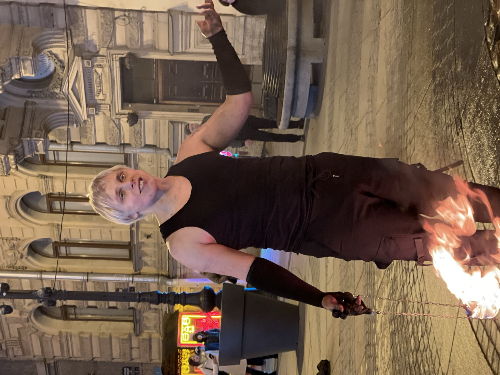 Street performers and vendors active during evening hours in Saint Petersburg