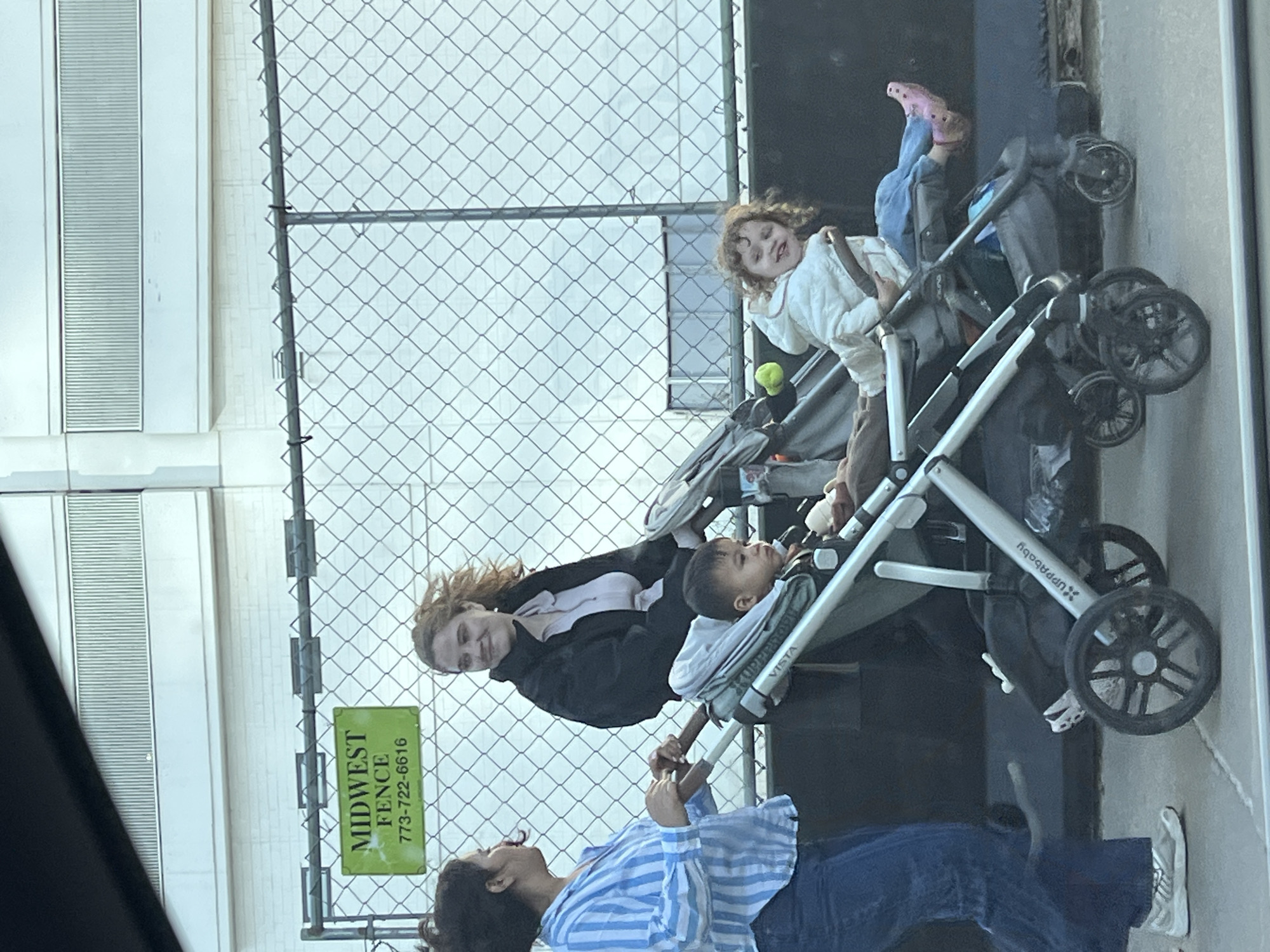 Two adults with strollers spotted interacting in Chicago